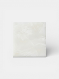 White Onyx cube sculpture featuring translucent marble with natural veining and Italian craftsmanship