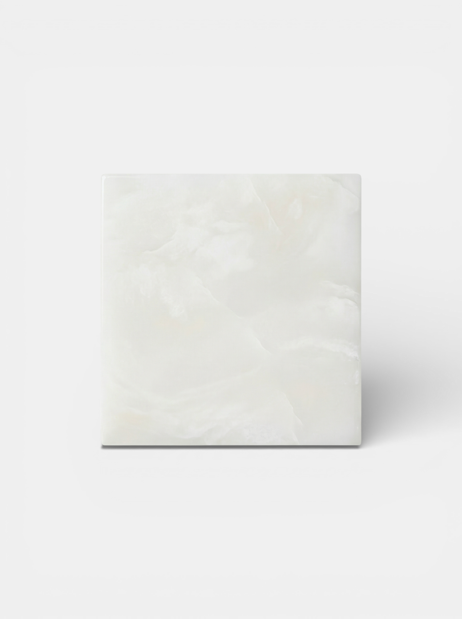 White Onyx cube sculpture featuring translucent marble with natural veining and Italian craftsmanship