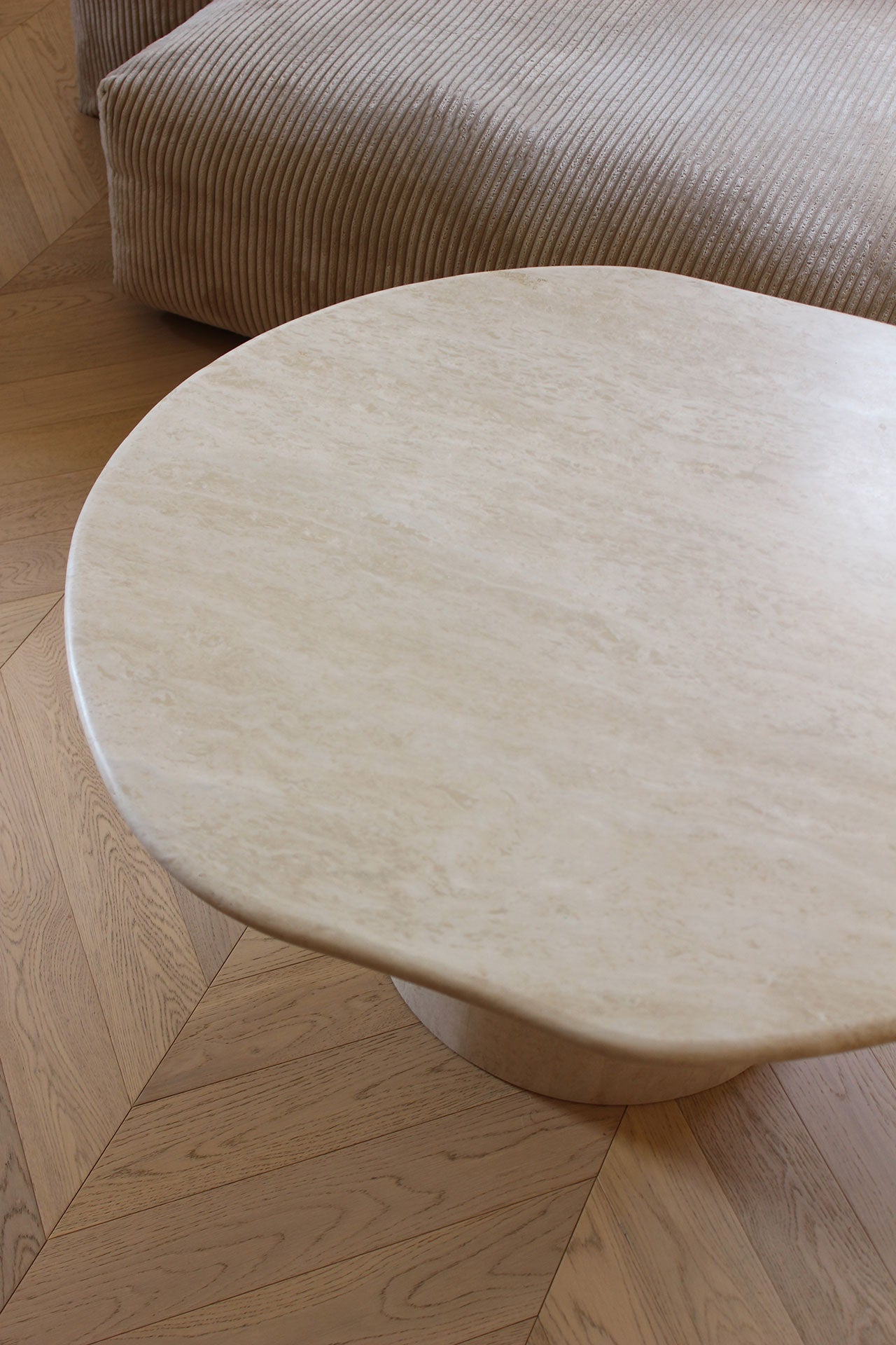 Joan Solo travertine table detail showcasing natural stone patterns - handcrafted Italian design
