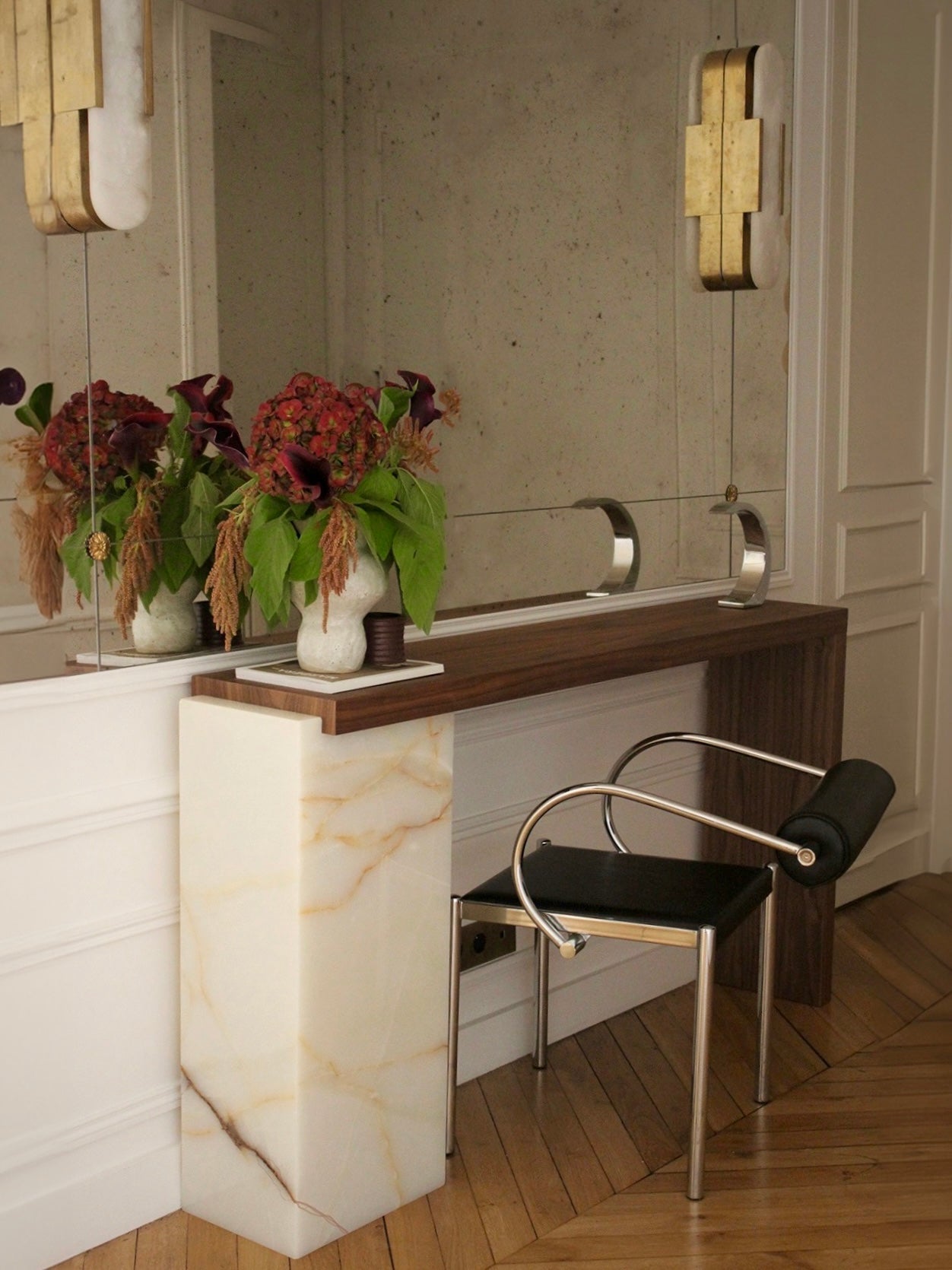 Detail photo of Jill console showcasing Shell Onyx marble patterns and rich wood grain combination