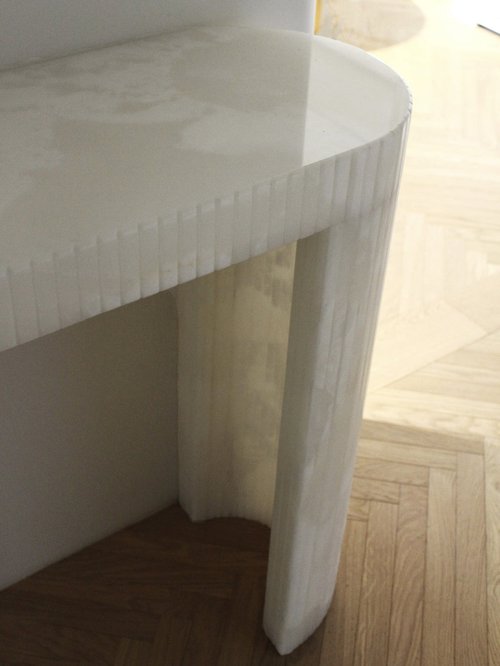 Luna White Onyx console close-up shot revealing natural white onyx stone texture and veining
