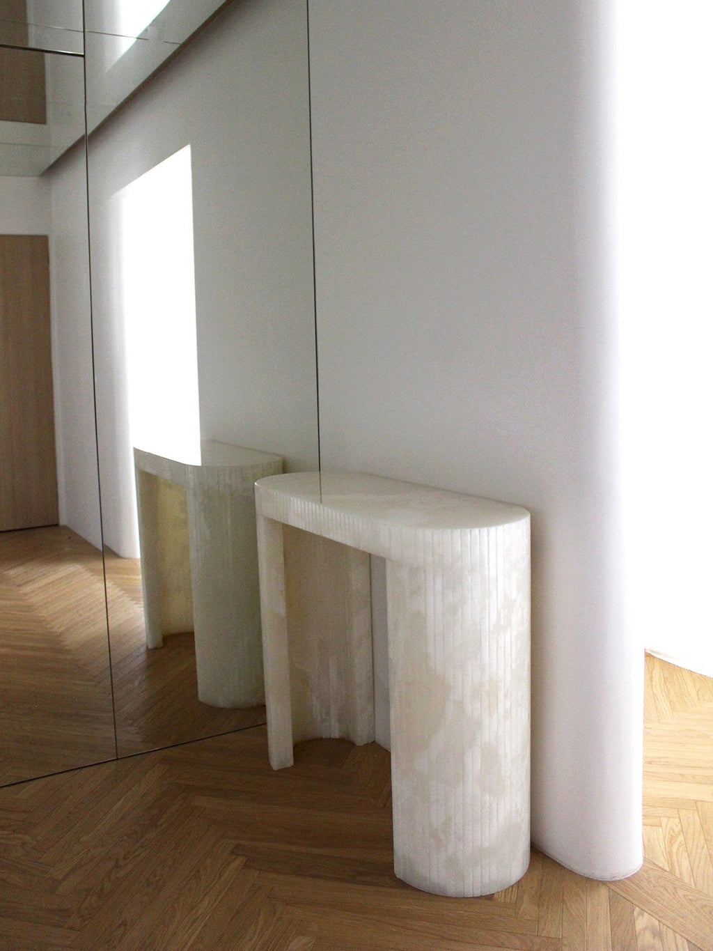 Luna White Onyx console detail view showcasing natural white onyx stone patterns and translucency