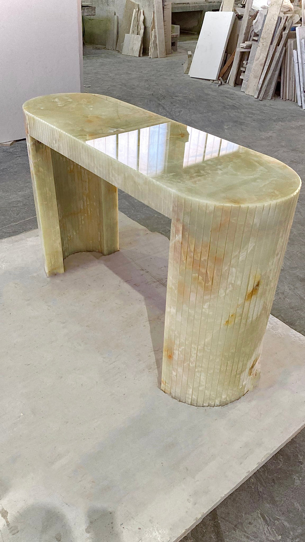 Luna Green Onyx console detail shot highlighting natural green onyx stone patterns and translucency