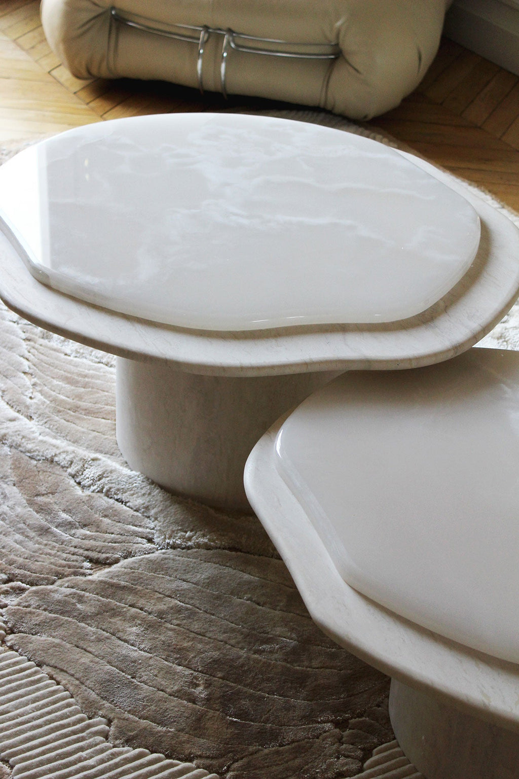 Angled view of Nuga Duo white onyx and travertine coffee table, Italian marble furniture design