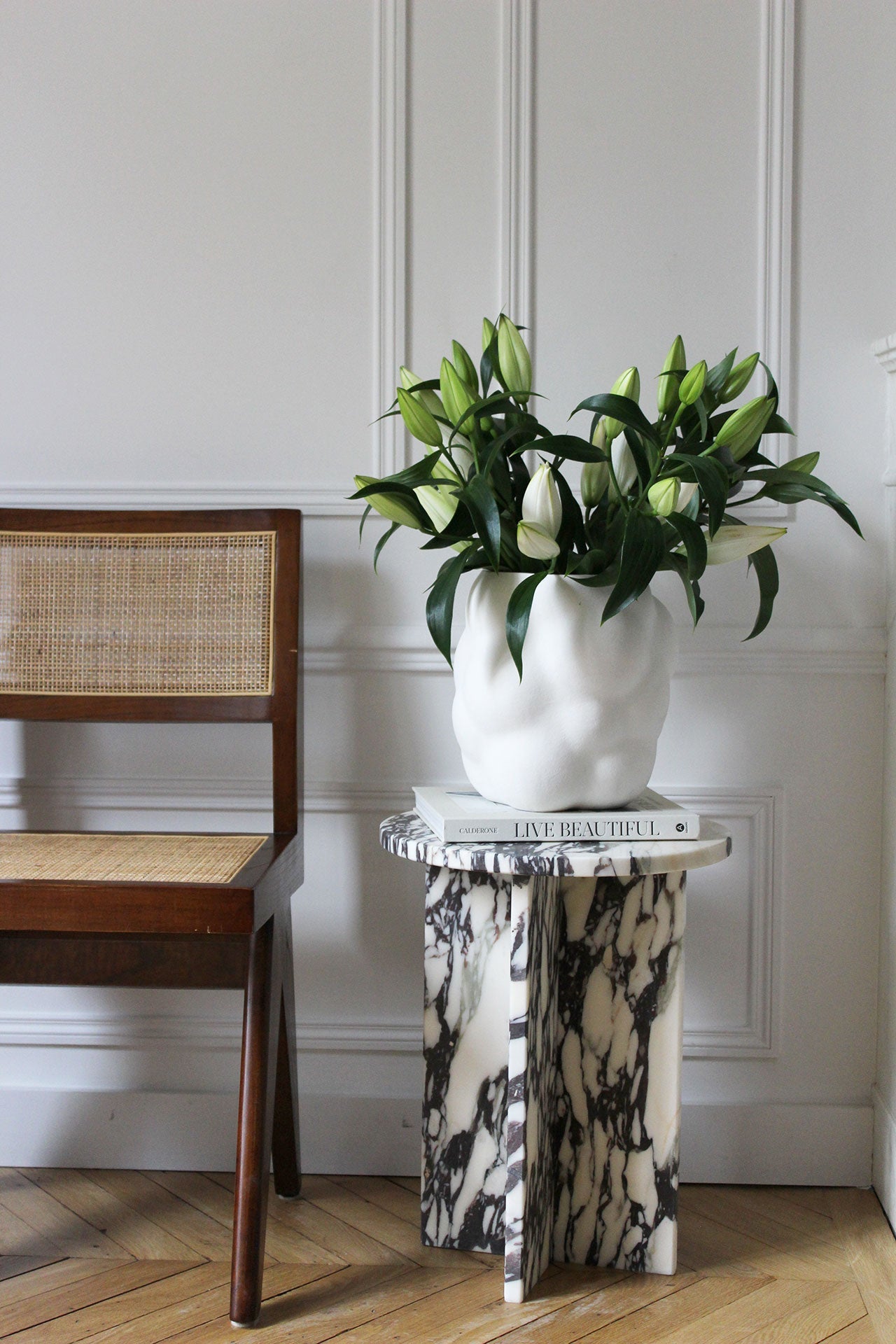Detail view of Rosie table showcasing Calacatta Viola marble patterns and Italian stonework artistry