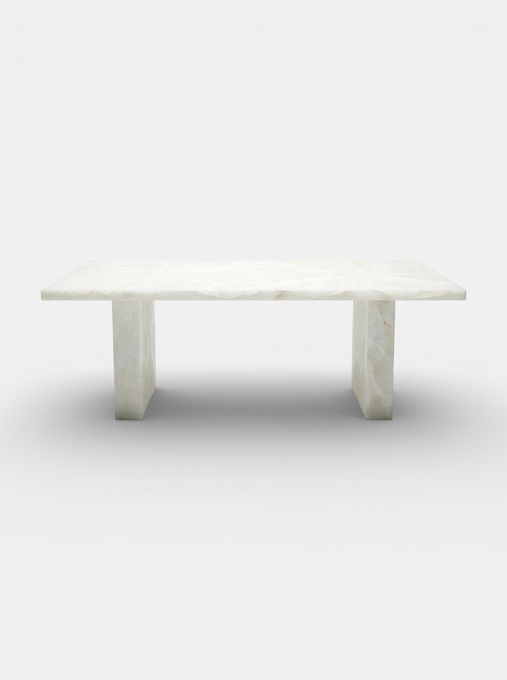 Aura White Onyx dining table front view - premium Italian marble furniture with translucent veining
