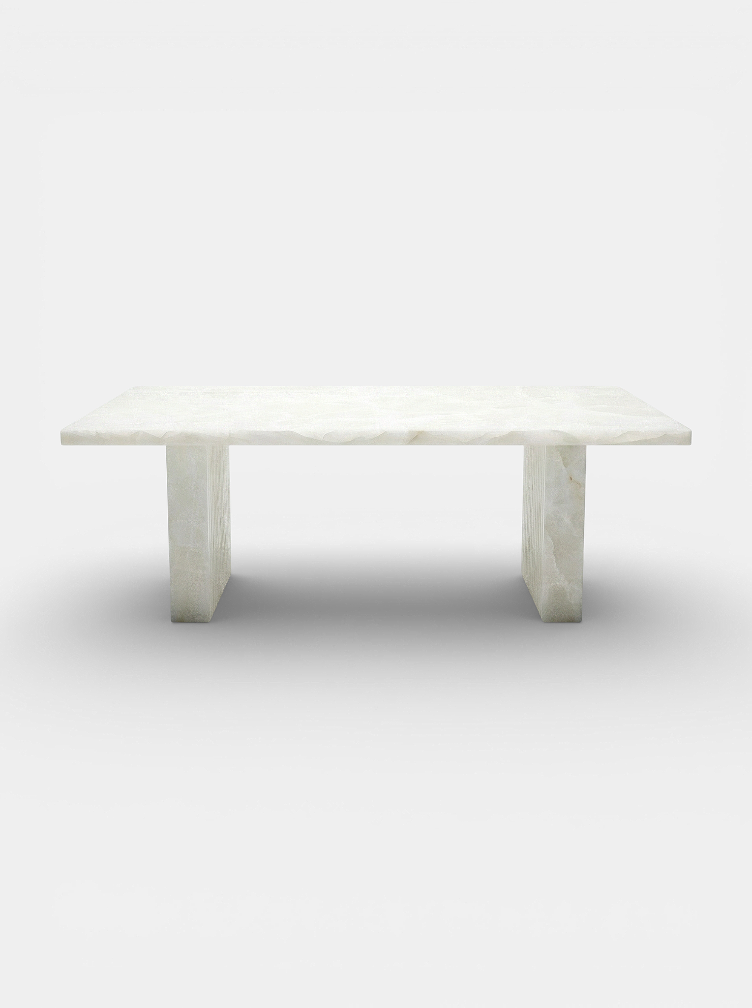 Aura White Onyx dining table front view - premium Italian marble furniture with translucent veining