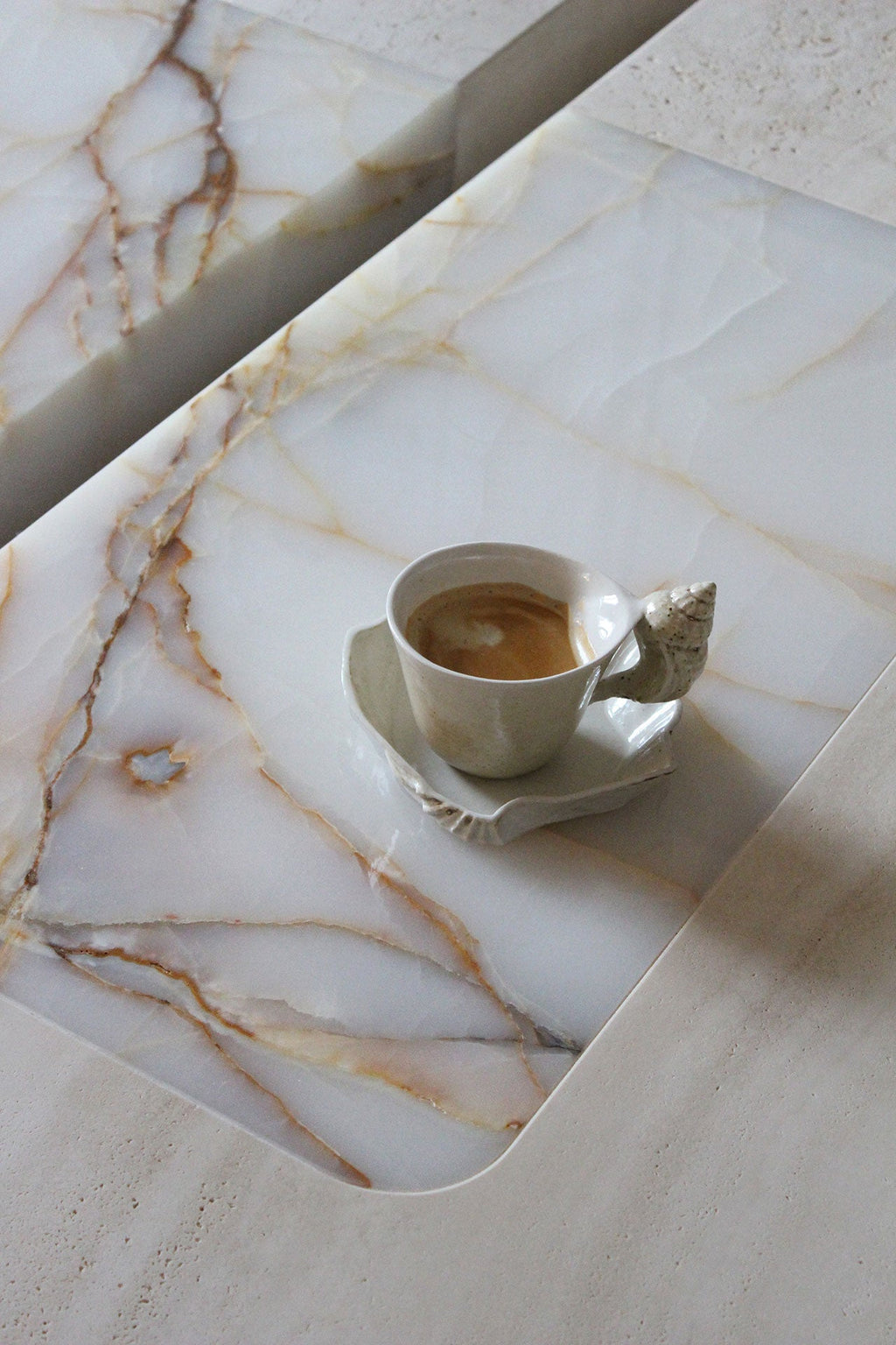 Baci marble coffee table lifestyle shot - luxury Italian furniture in modern interior setting