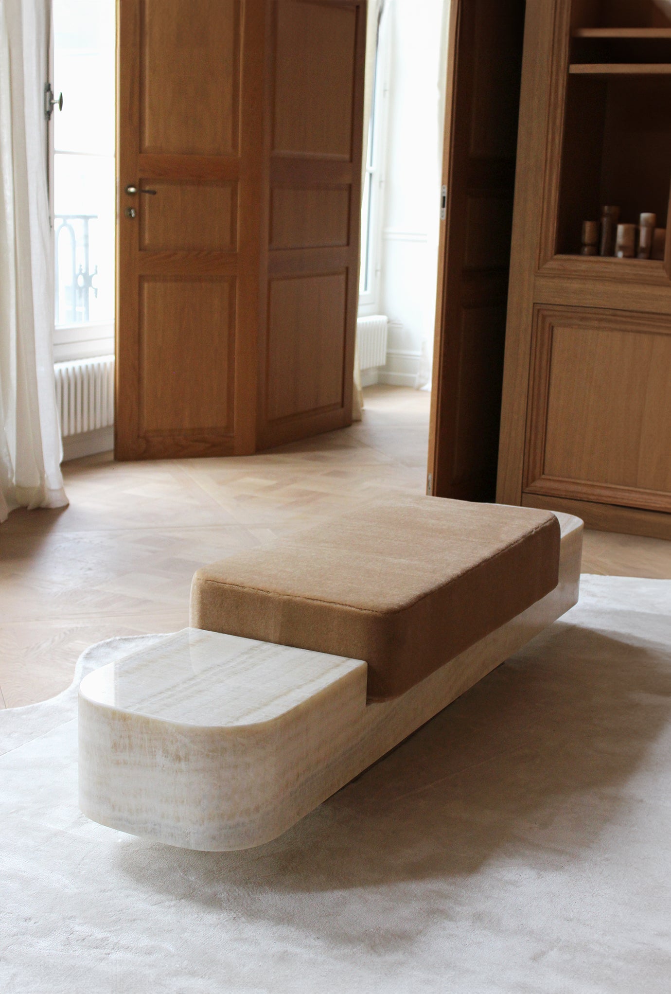 Front perspective of Ran marble bench showcasing elegant Italian stonework and contemporary design