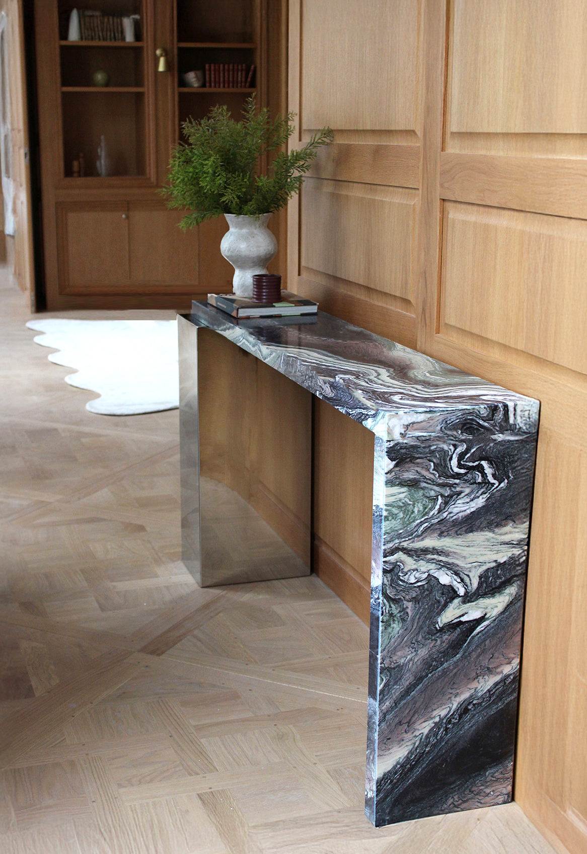 Detail view of Cipolino marble Jill console highlighting unique green stone characteristics and finish