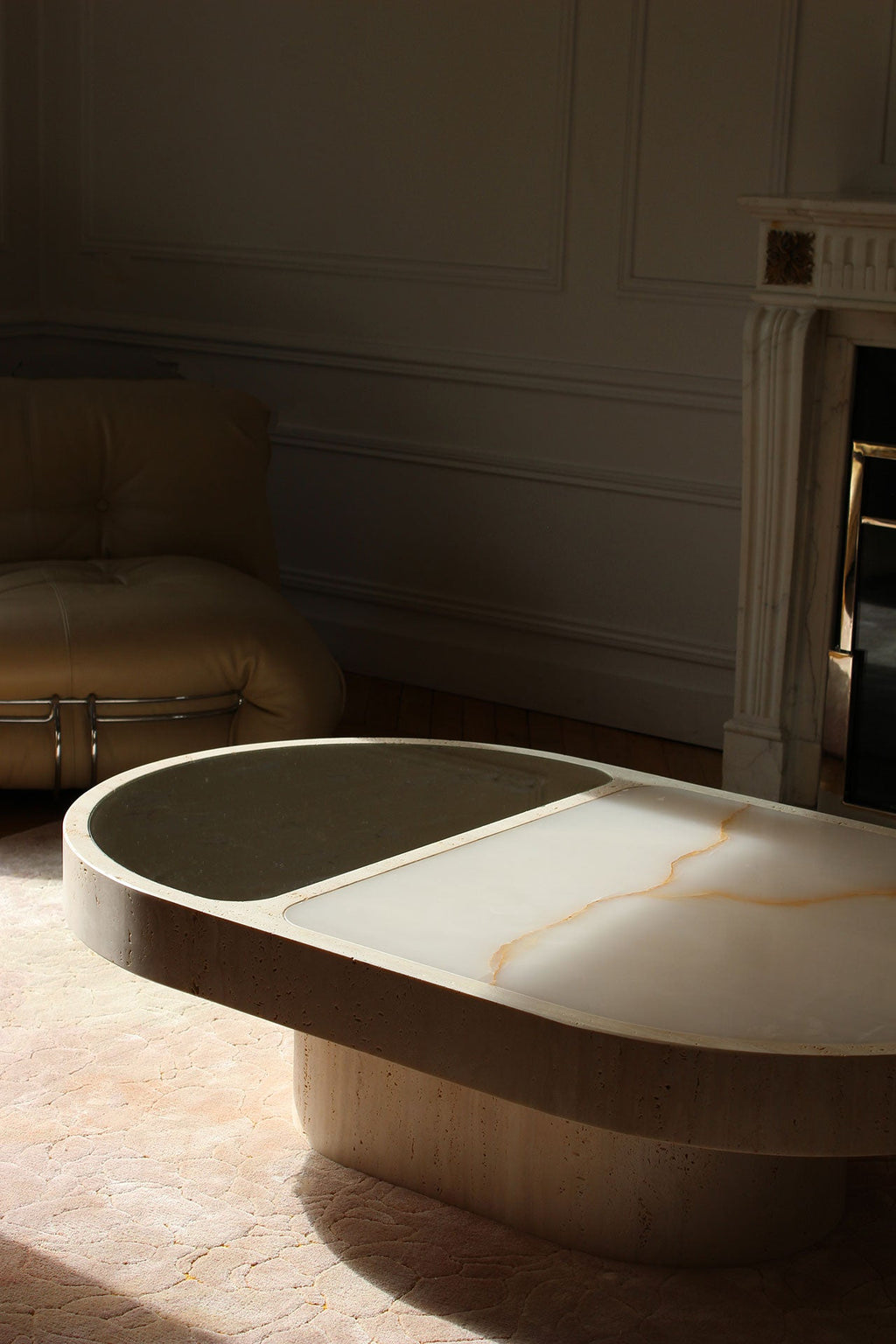 Dramatic lighting on shell onyx coffee table highlighting marble's natural beauty - MARBERA craftsmanship