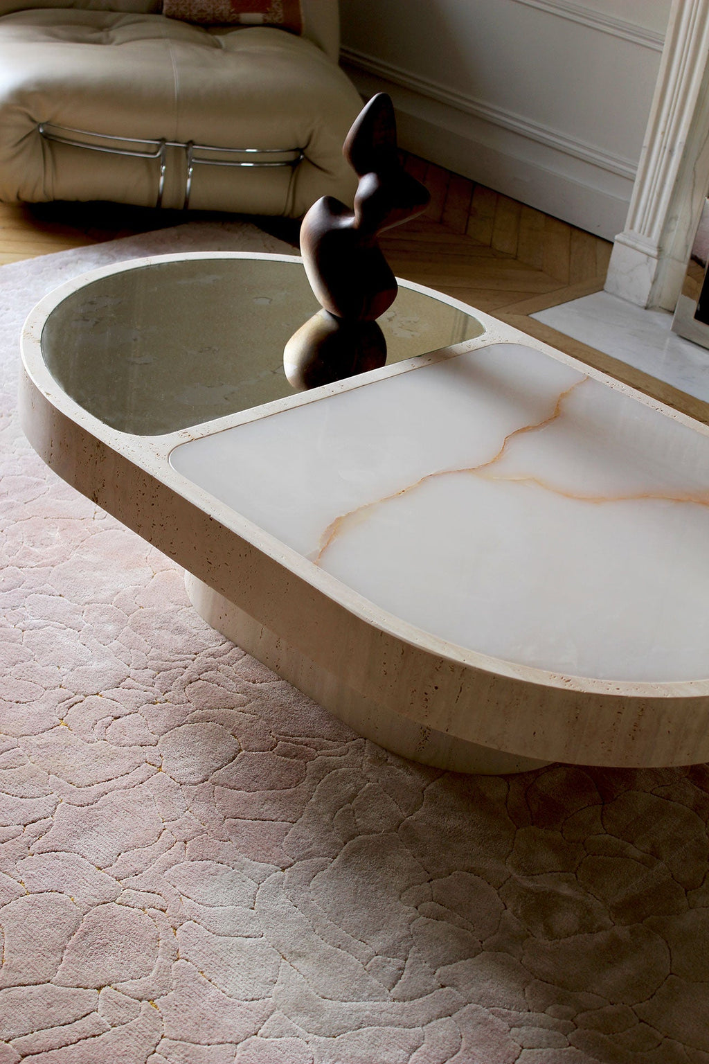 Top view of shell onyx marble surface on travertine coffee table - MARBERA luxury stone furniture detail