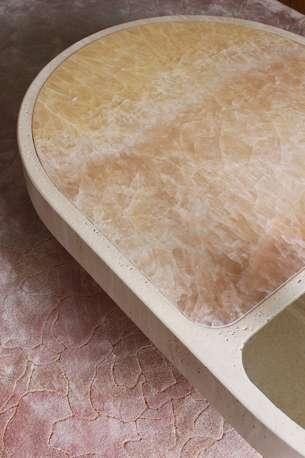 Close-up of sunset onyx marble top on travertine base - premium MARBERA Italian craftsmanship