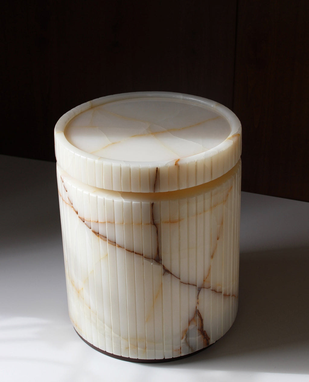 Close-up detail of Drey onyx table's natural marble veining and Italian craftsmanship quality