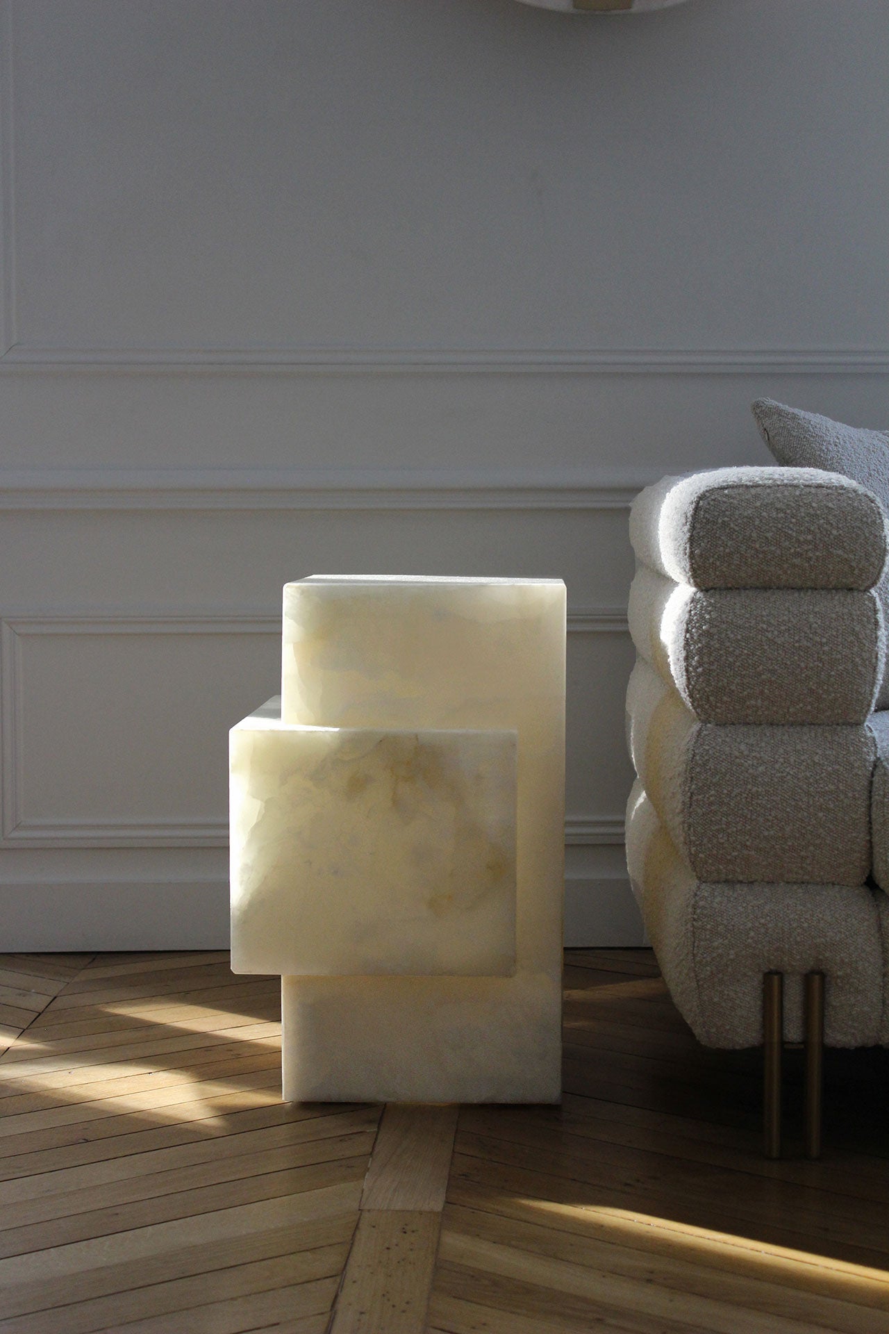 White onyx table illuminated showing translucent marble beauty, Italian luxury dining furniture