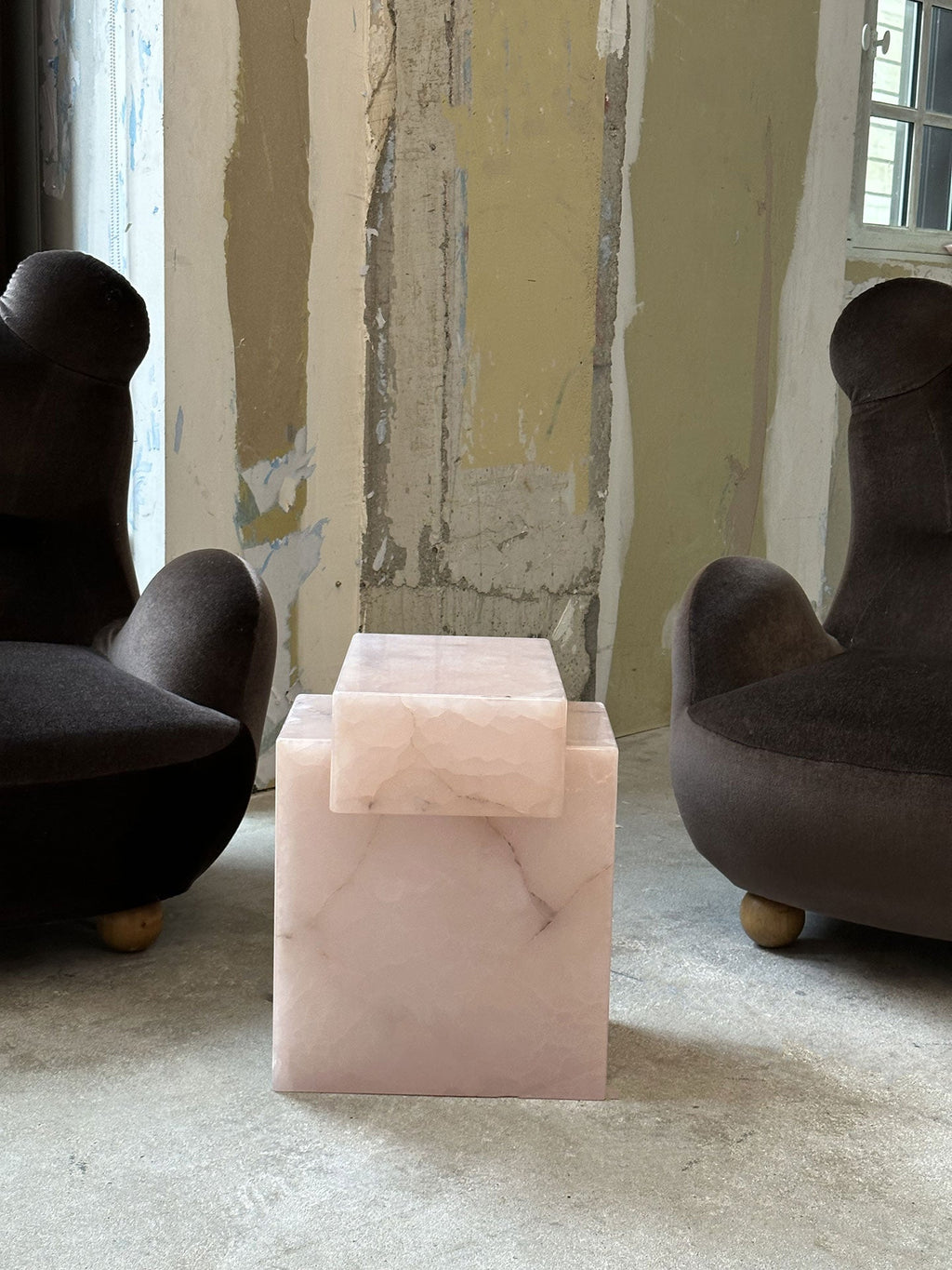 Pink onyx table in minimalist interior space demonstrating versatile luxury marble furniture styling
