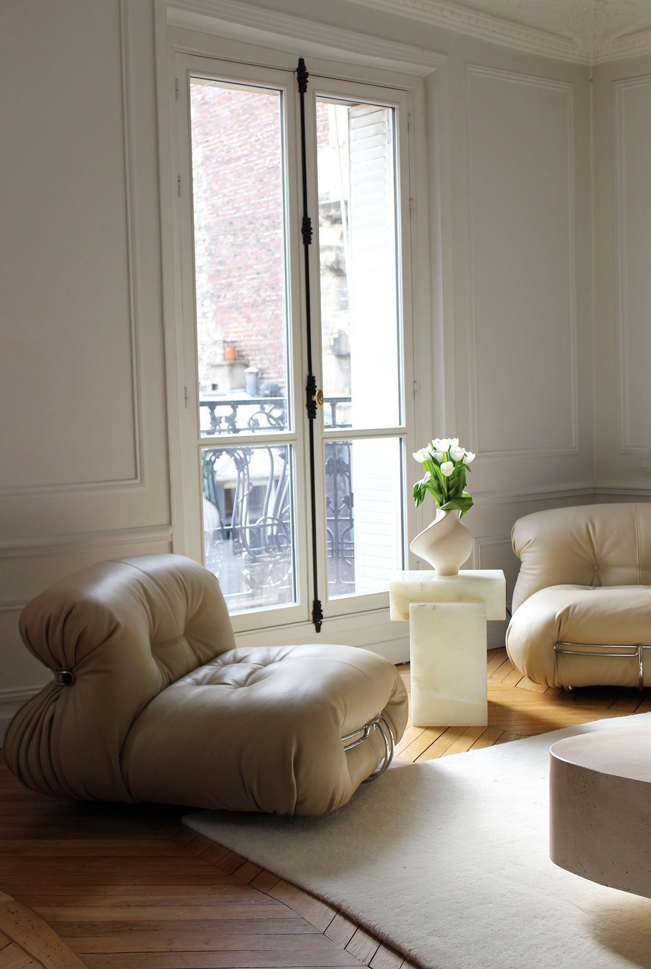 Gaia white onyx marble table profile in elegant room setting demonstrating Italian luxury design