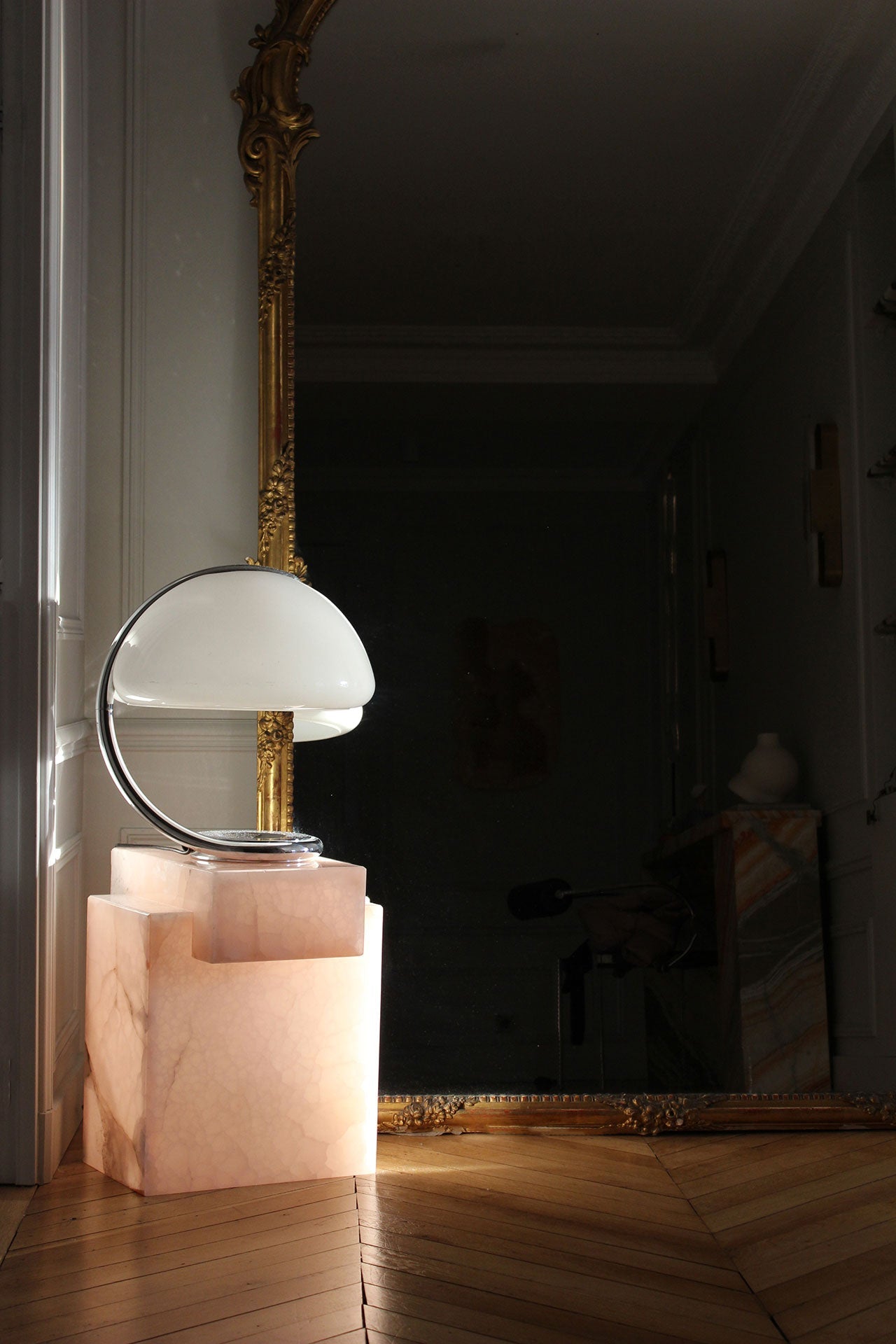 Pink onyx marble table in modern entryway setting highlighting luxury furniture and interior design