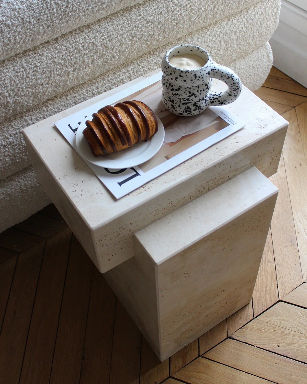 Elegant travertine table styled in minimalist living space showcasing natural marble characteristics
