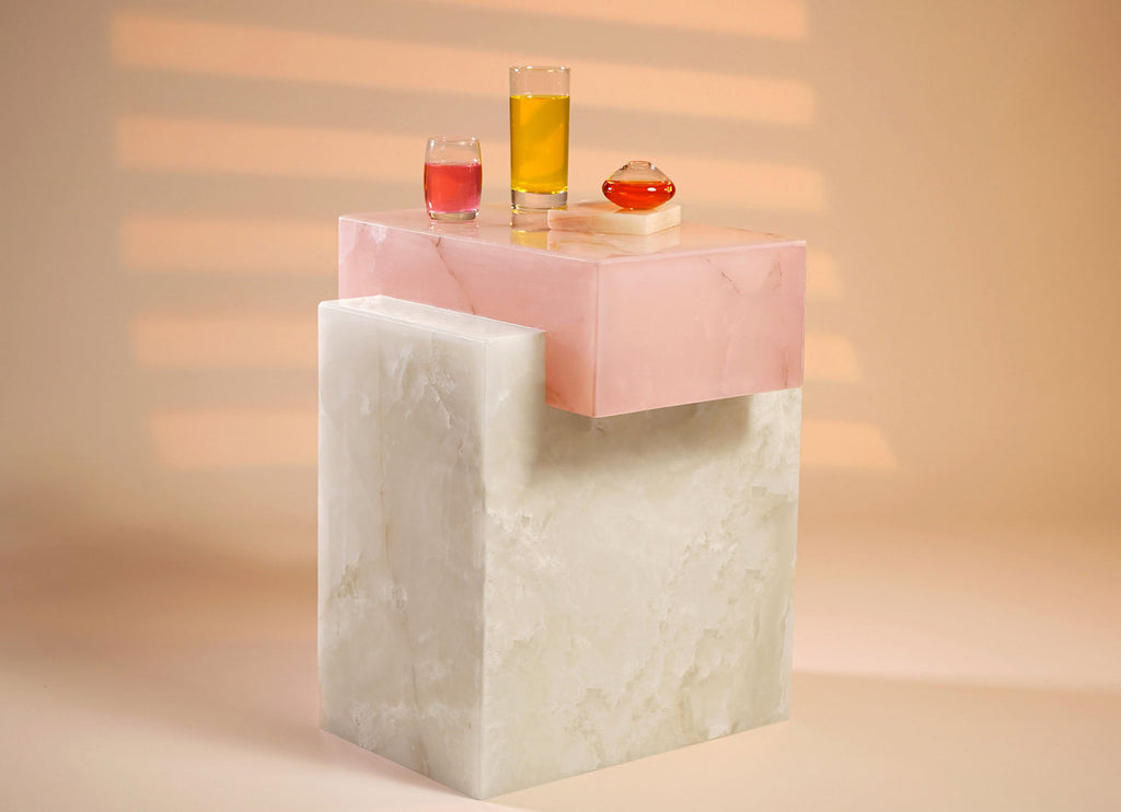 White and pink onyx table in styled interior photoshoot showcasing luxury marble furniture elegance