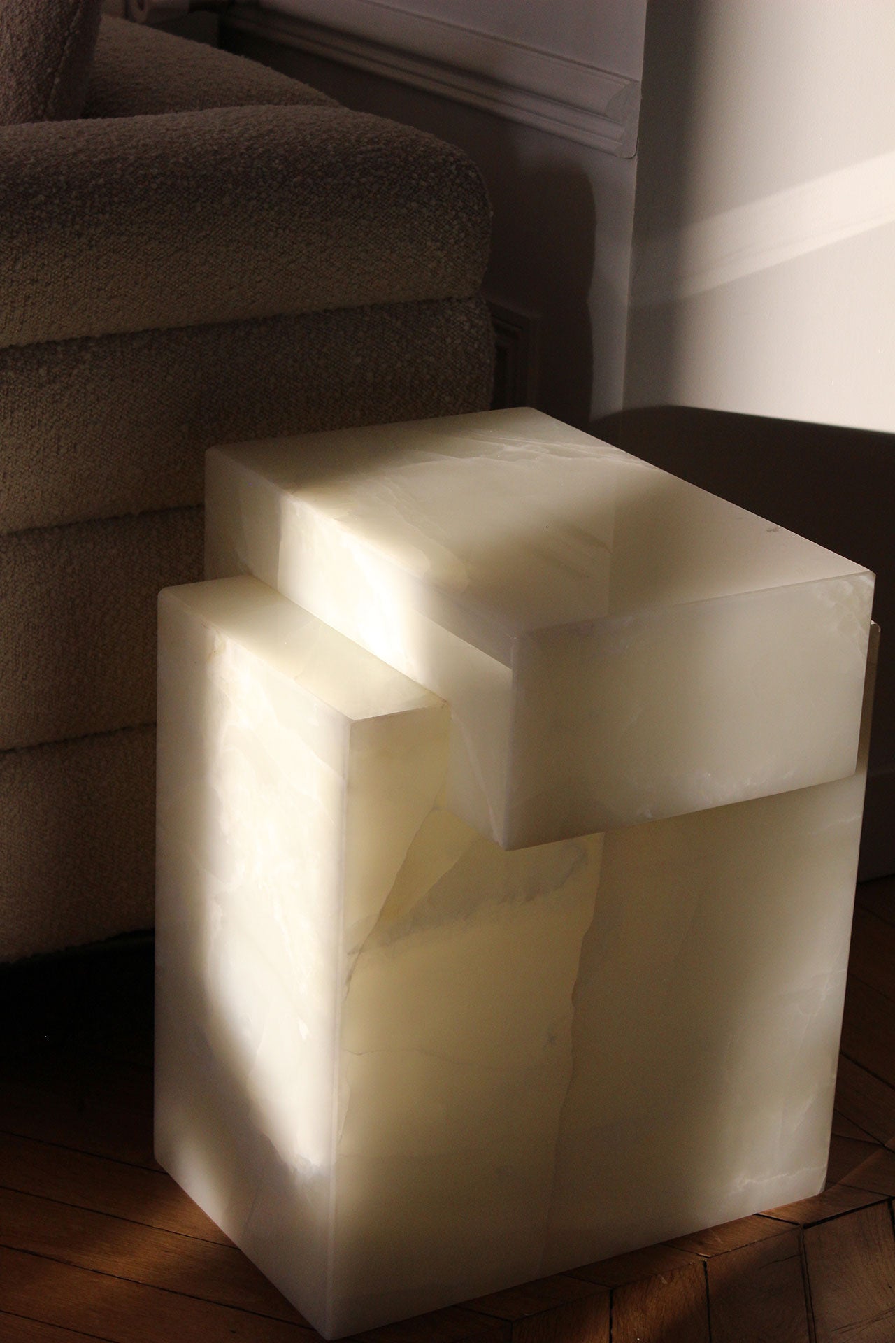 Gaia white onyx luxury table illuminated showing natural marble transparency and veining patterns