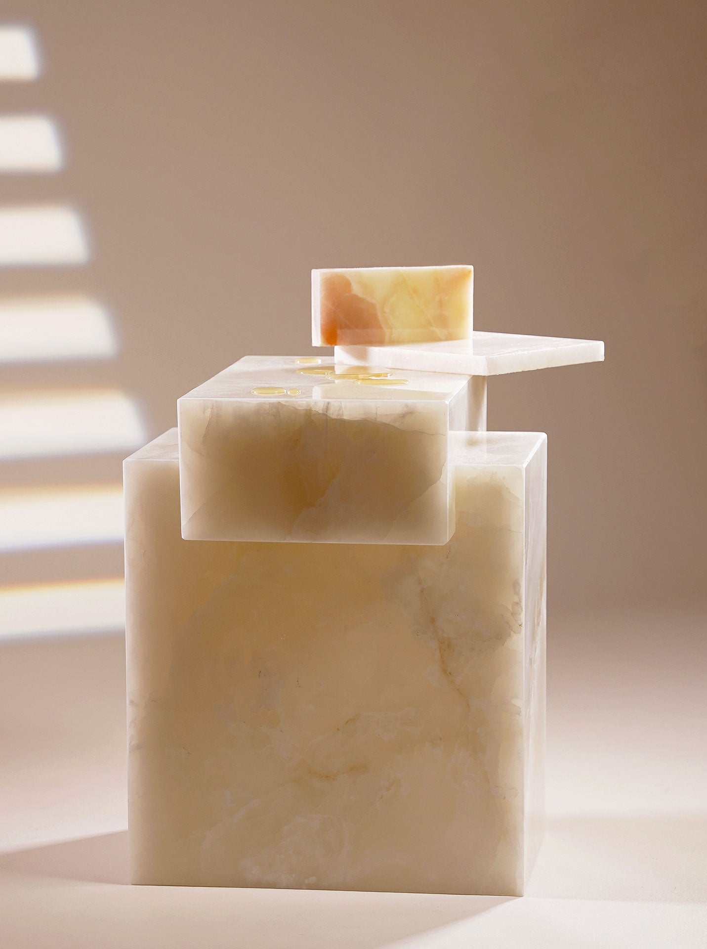 Gaia white onyx luxury marble table lifestyle photography highlighting elegant Italian design