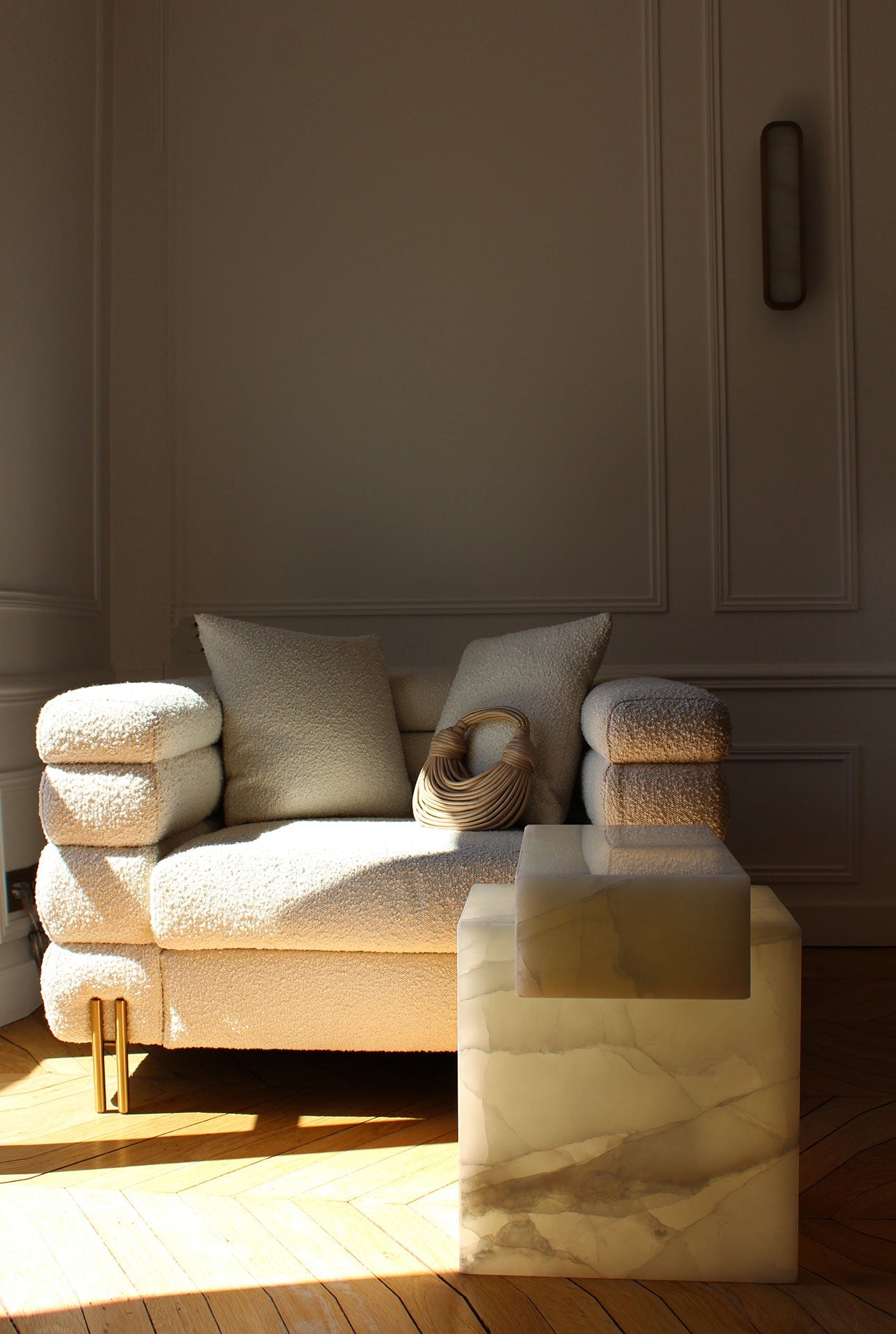 Gaia white onyx marble table styled in modern interior setting with contemporary decor