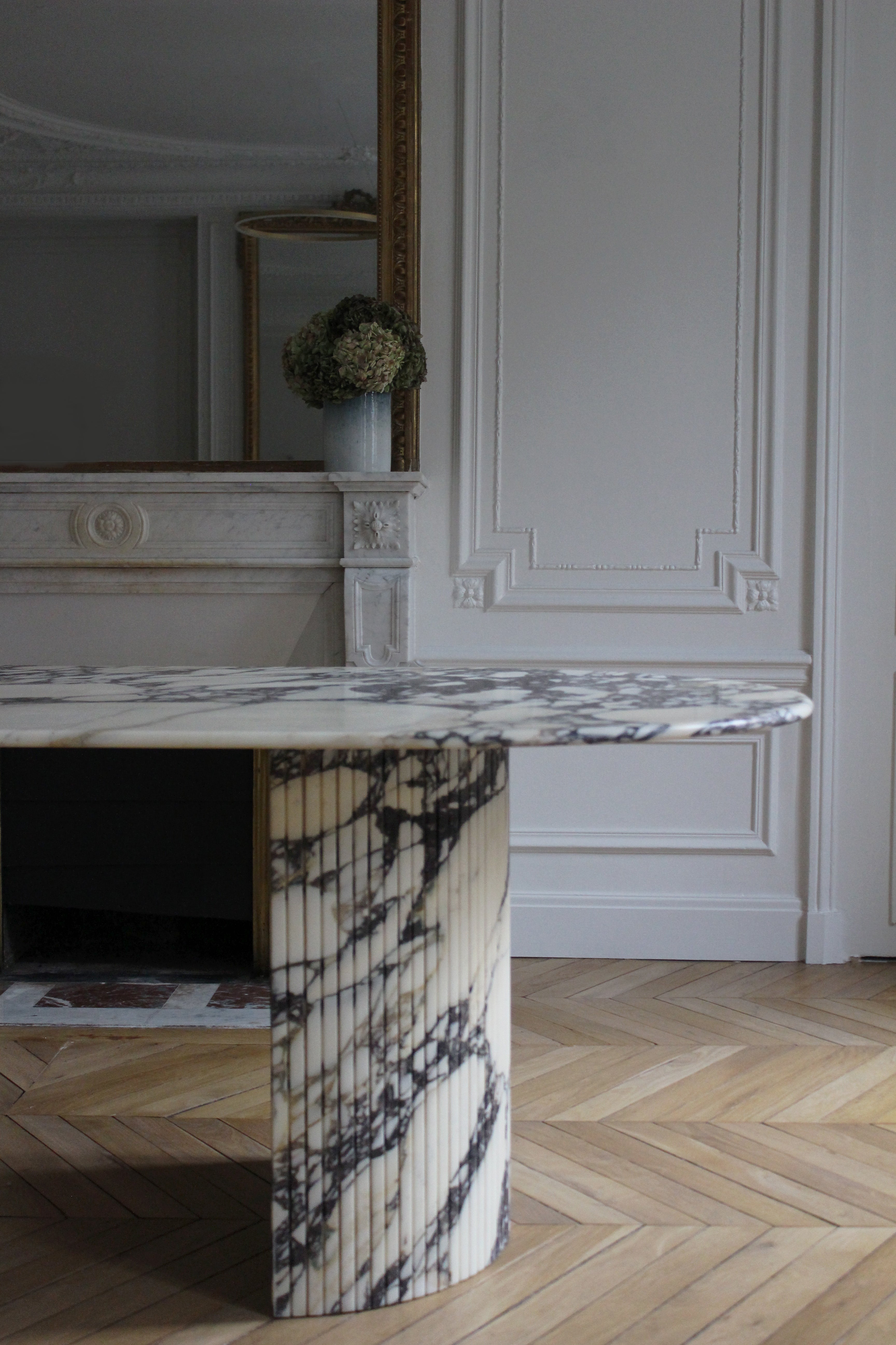 Luna Calacatta Viola marble dining table detail shot showing natural purple marble veining texture