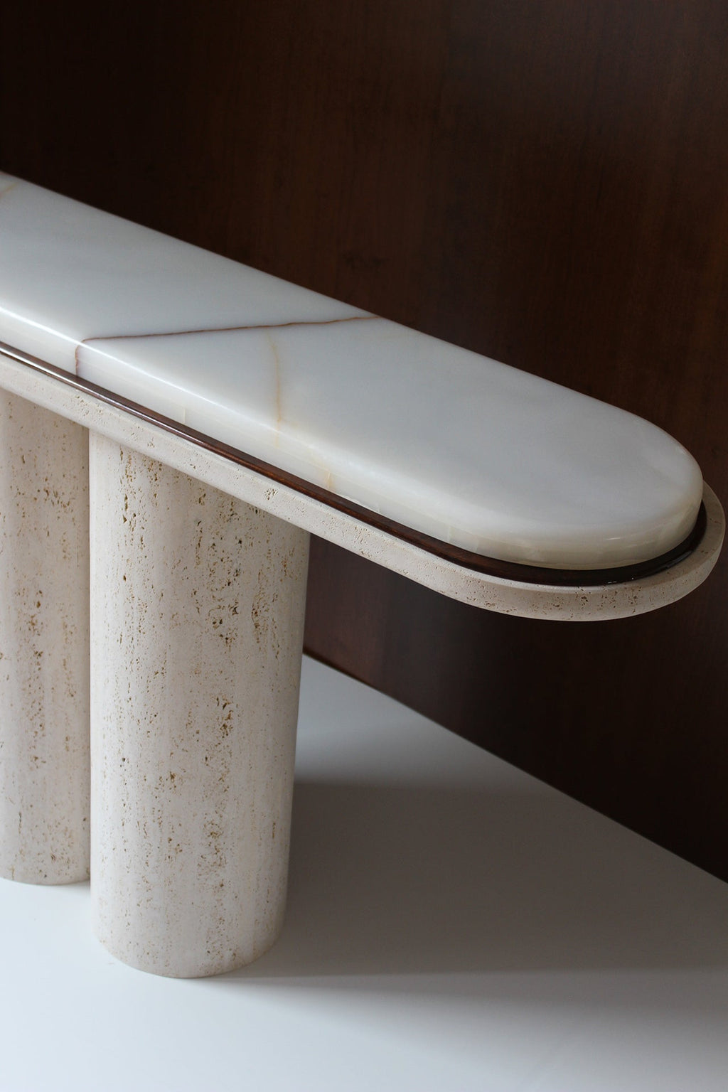 Luxury Ida console in travertine and onyx stone - Italian marble furniture - detail close-up view