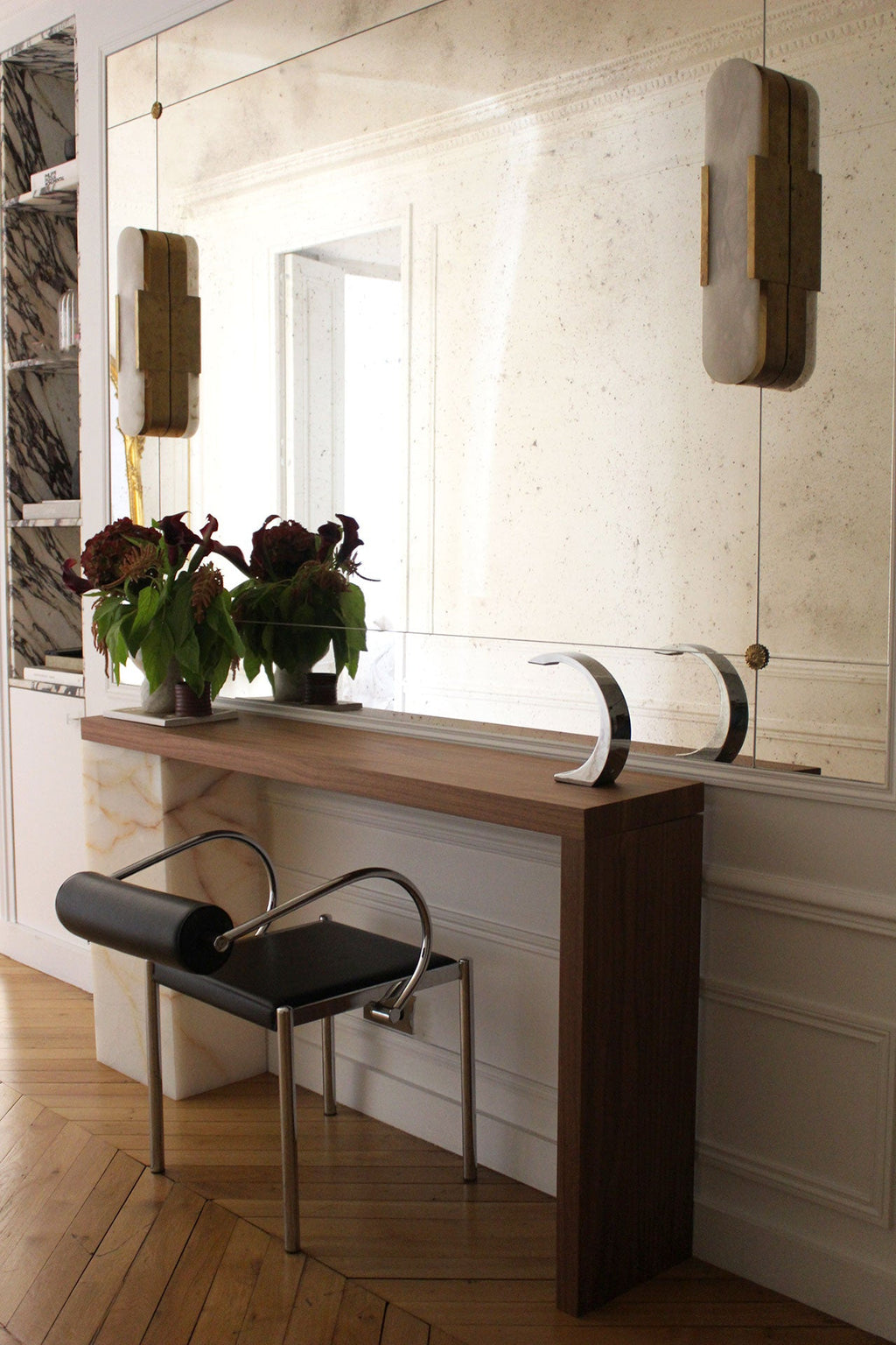 Lifestyle shot wood and Shell Onyx Jill console displaying natural marble beauty and wooden elements