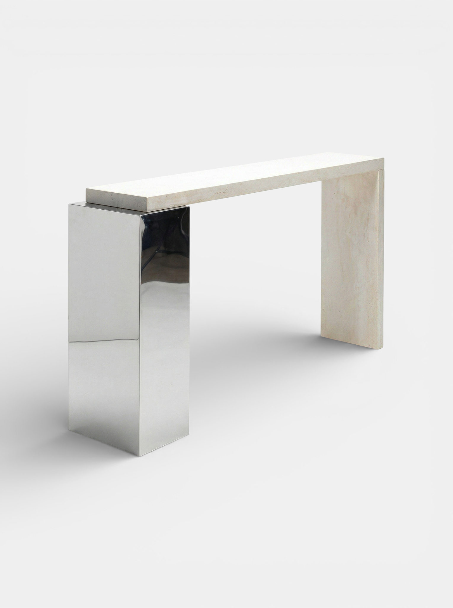 Three-quarter view of travertine Jill console displaying natural stone texture and stainless steel base