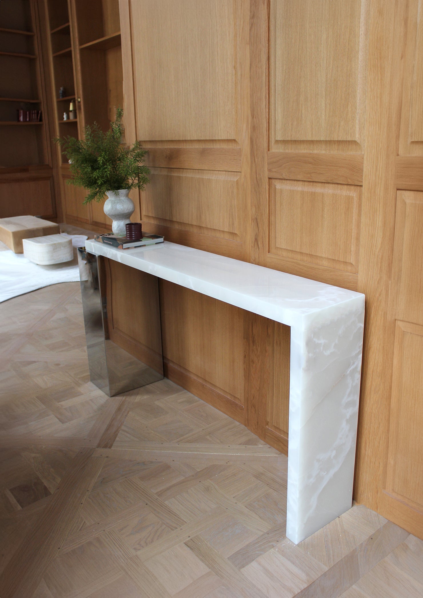 Detail shot of white onyx Jill console marble surface showing natural veining and luminous quality