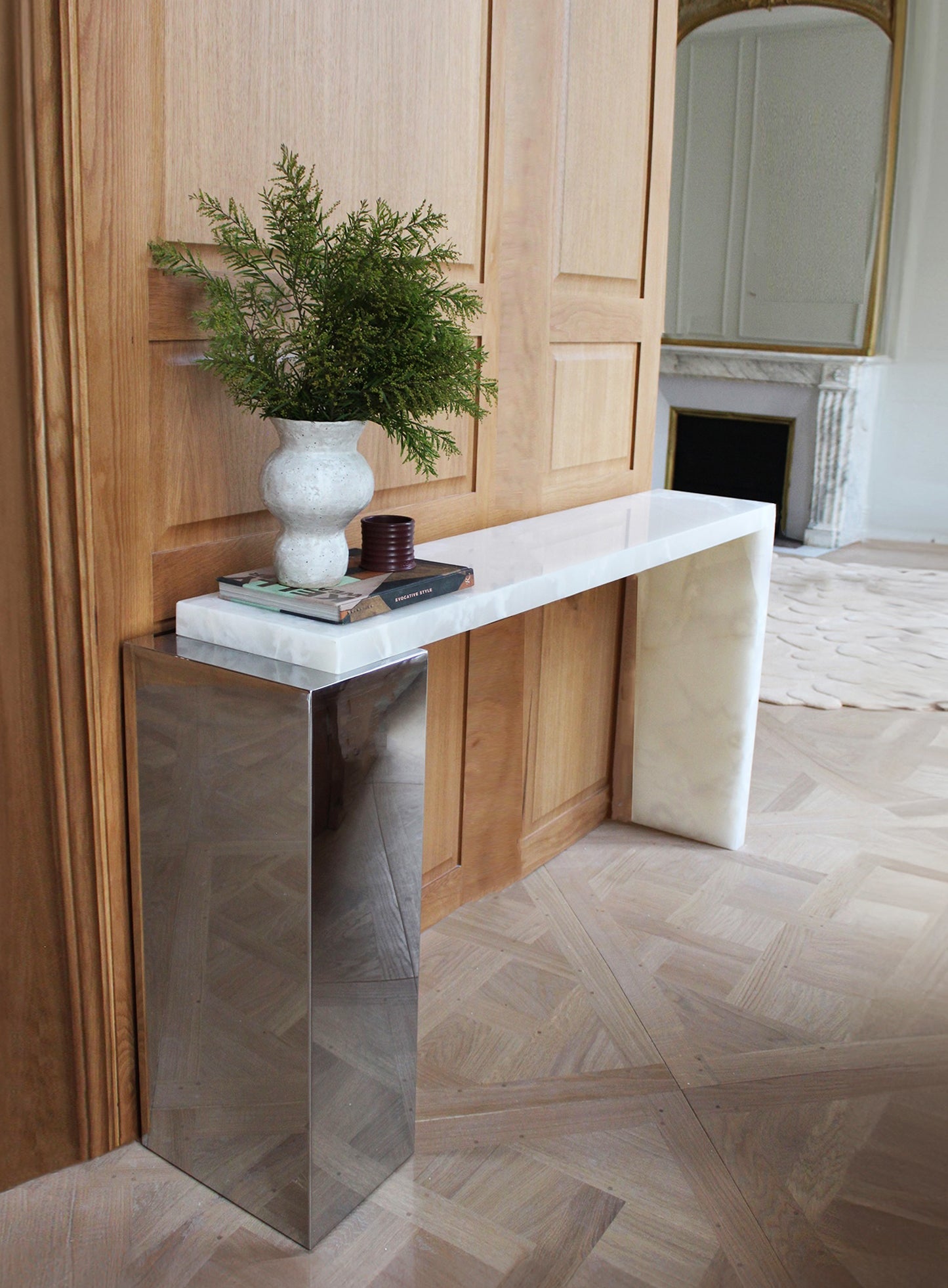 Lifestyle photo of white onyx Jill console showcasing translucent marble beauty and premium craftsmanship