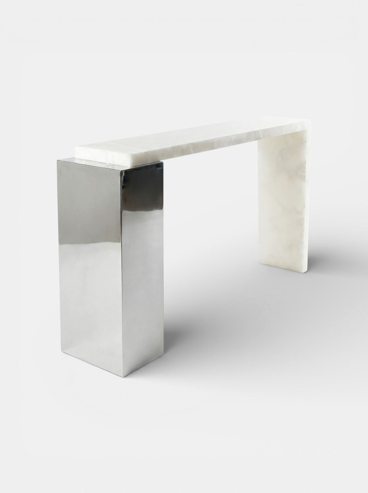 Right side view white onyx Jill console displaying luminous marble patterns and stainless steel base