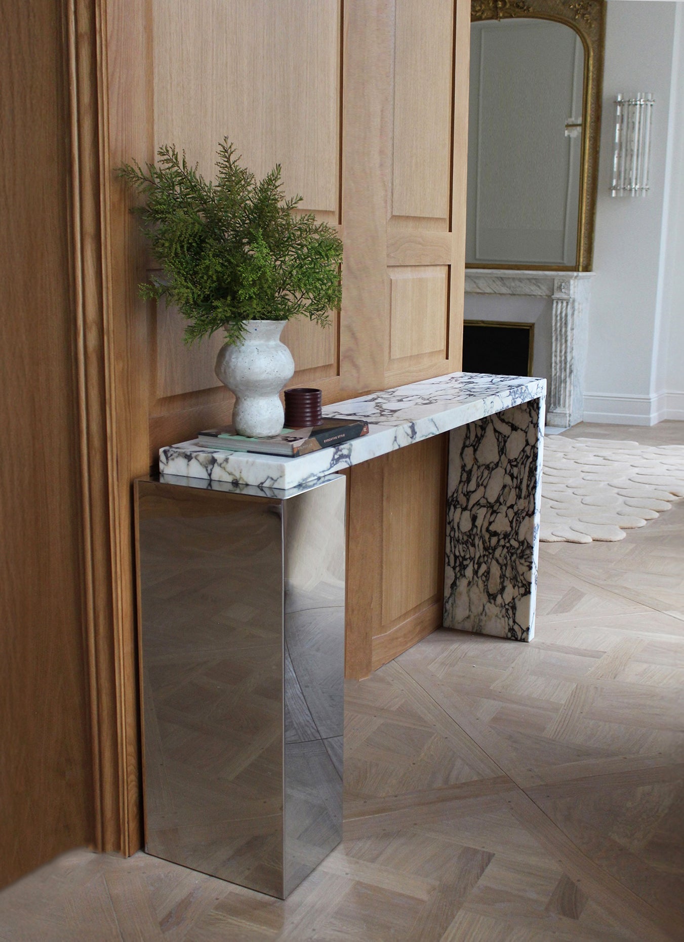 Calacatta Viola marble Jill console with stainless steel accents showcasing purple veining patterns