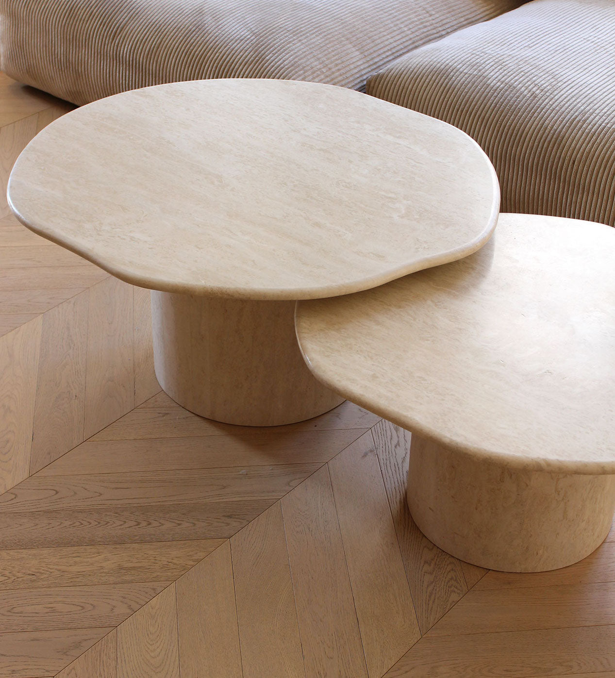 Close-up of Joan travertine coffee tables showing natural stone texture - handcrafted Italian design