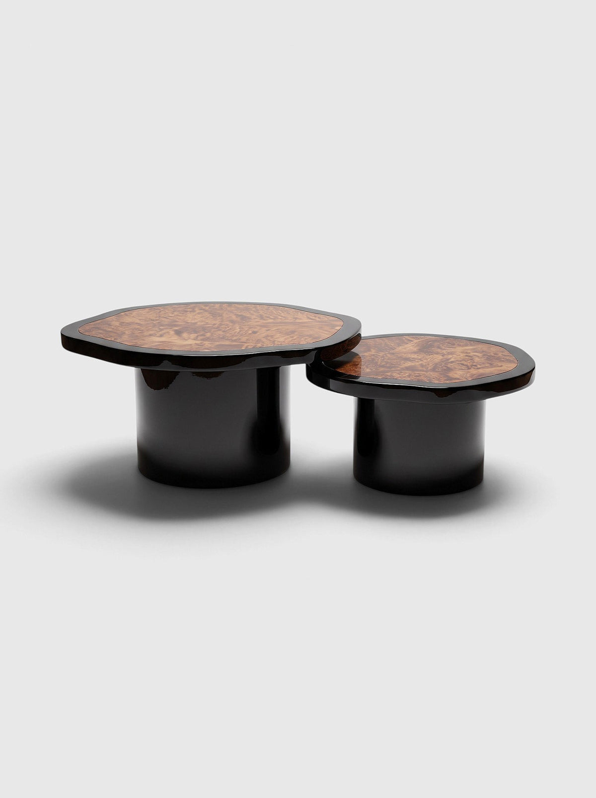 MARBERA Joan Duo coffee tables with high-gloss black lacquered bases and dark burl wood tops