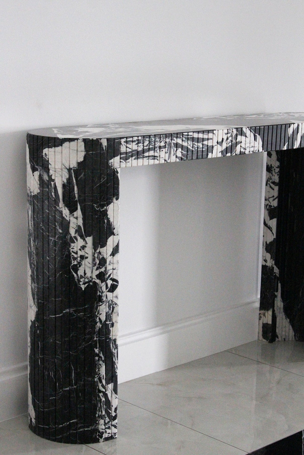 Luna Grand Antique marble console lifestyle shot - elegant Italian dark marble furniture piece