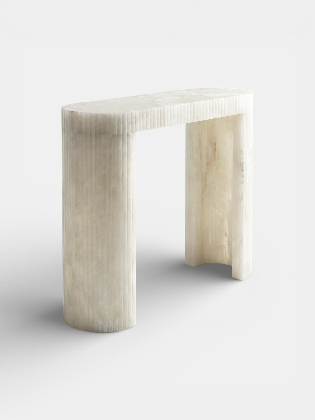 Luna White Onyx console three-quarter left view showing natural white onyx stone translucency