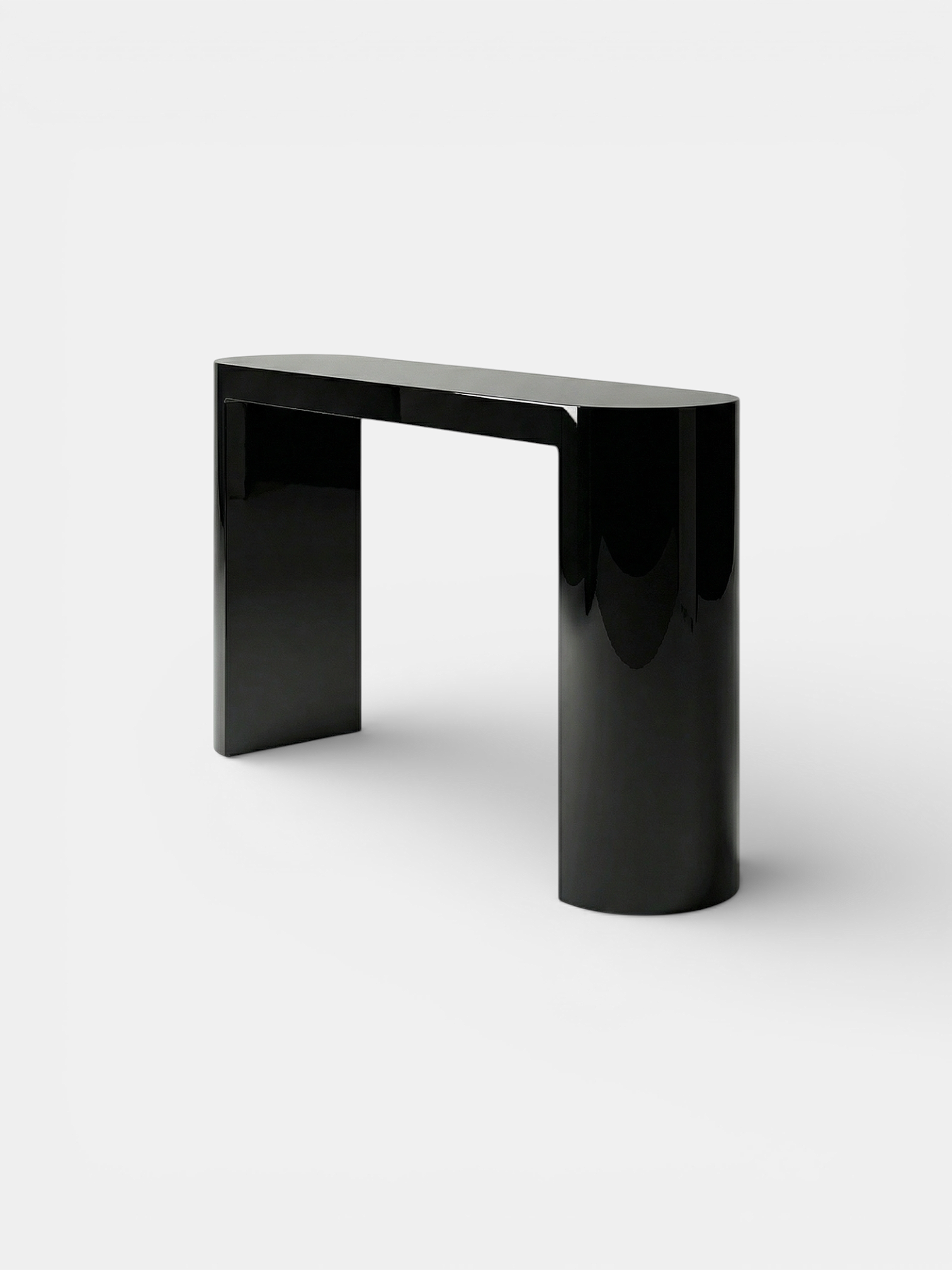 Luna black lacquered console side angle view showing sleek curved silhouette - premium Italian design
