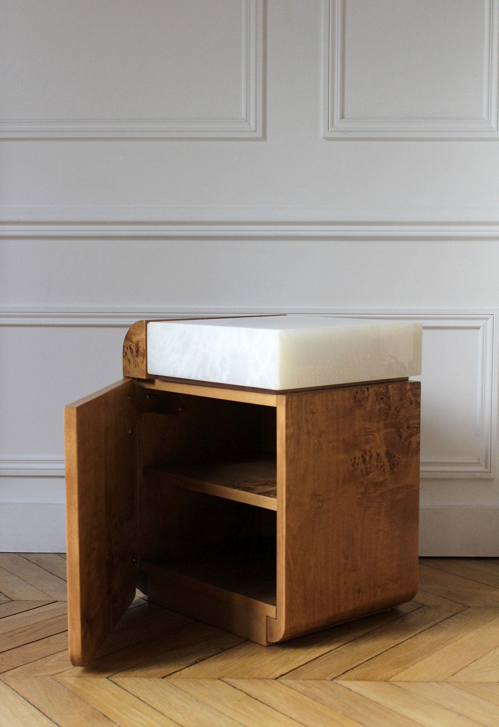 Profile view of open burl wood storage table showing white onyx interior - MARBERA Italian design