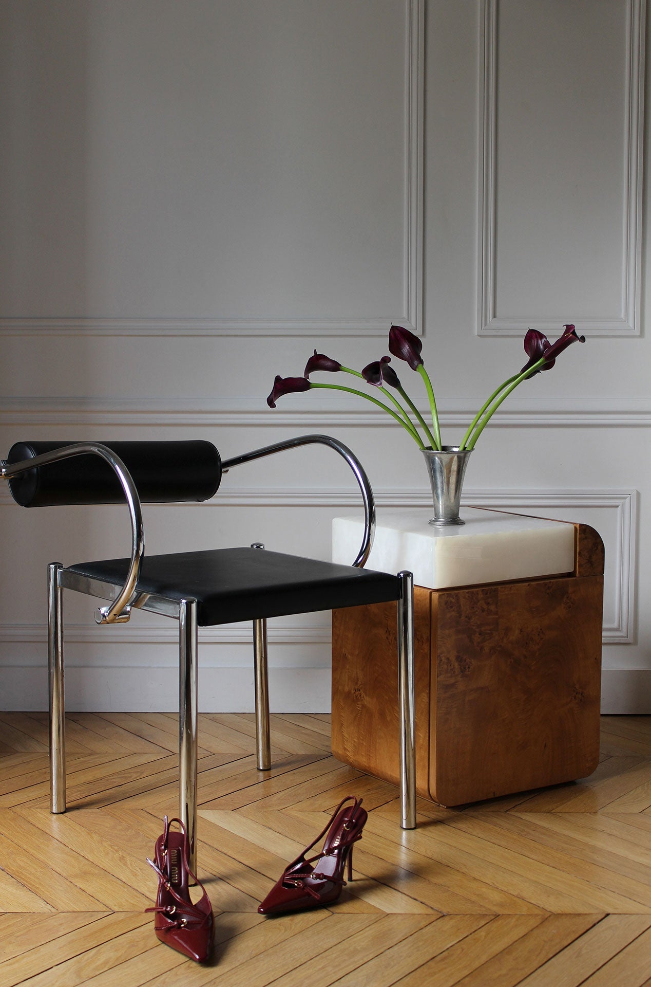 Lifestyle setting of burl wood Amo storage table with white onyx - luxury Italian marble furniture