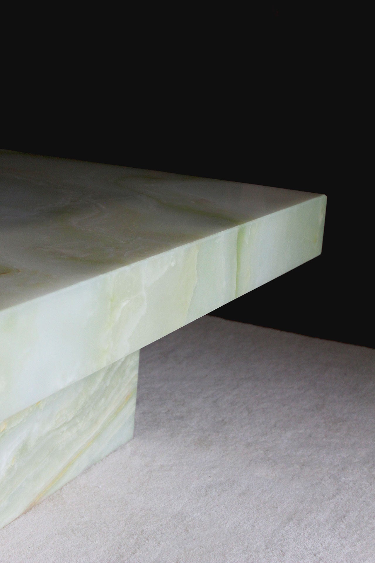 Green onyx Cara coffee table profile view - Italian marble furniture with translucent stone beauty
