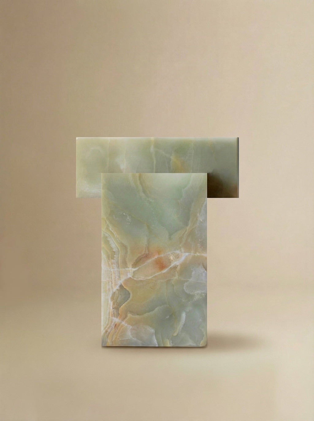 Green onyx table profile view displaying smooth curves and natural stone patterns in premium quality