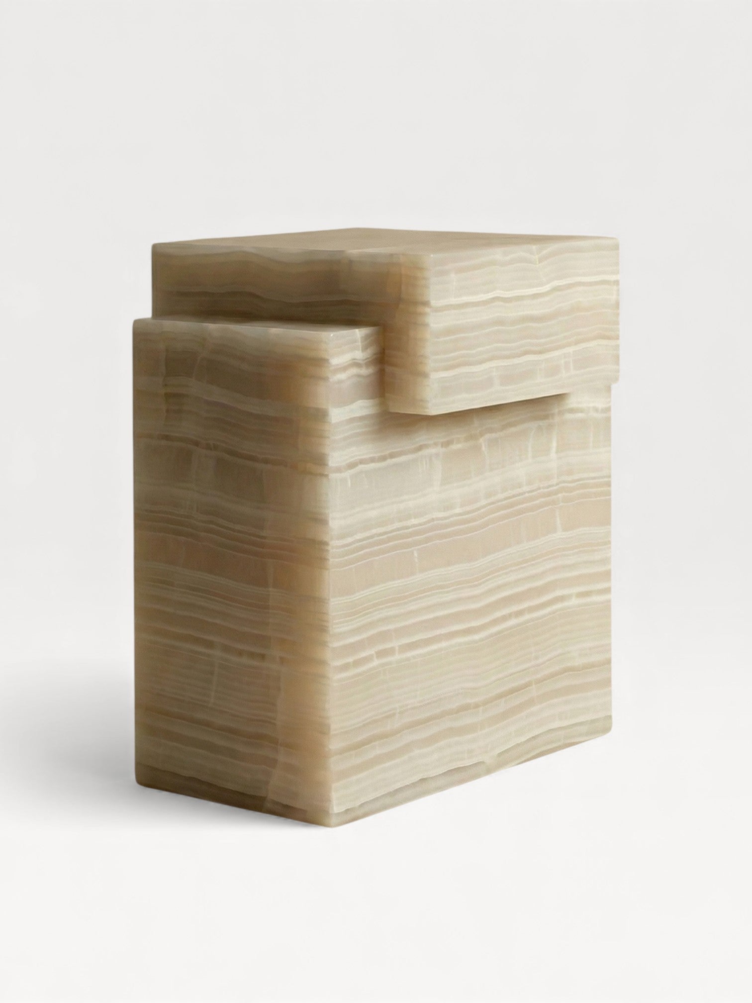 Front detail view of handcrafted ivory onyx marble table with smooth sculptural curves and veining