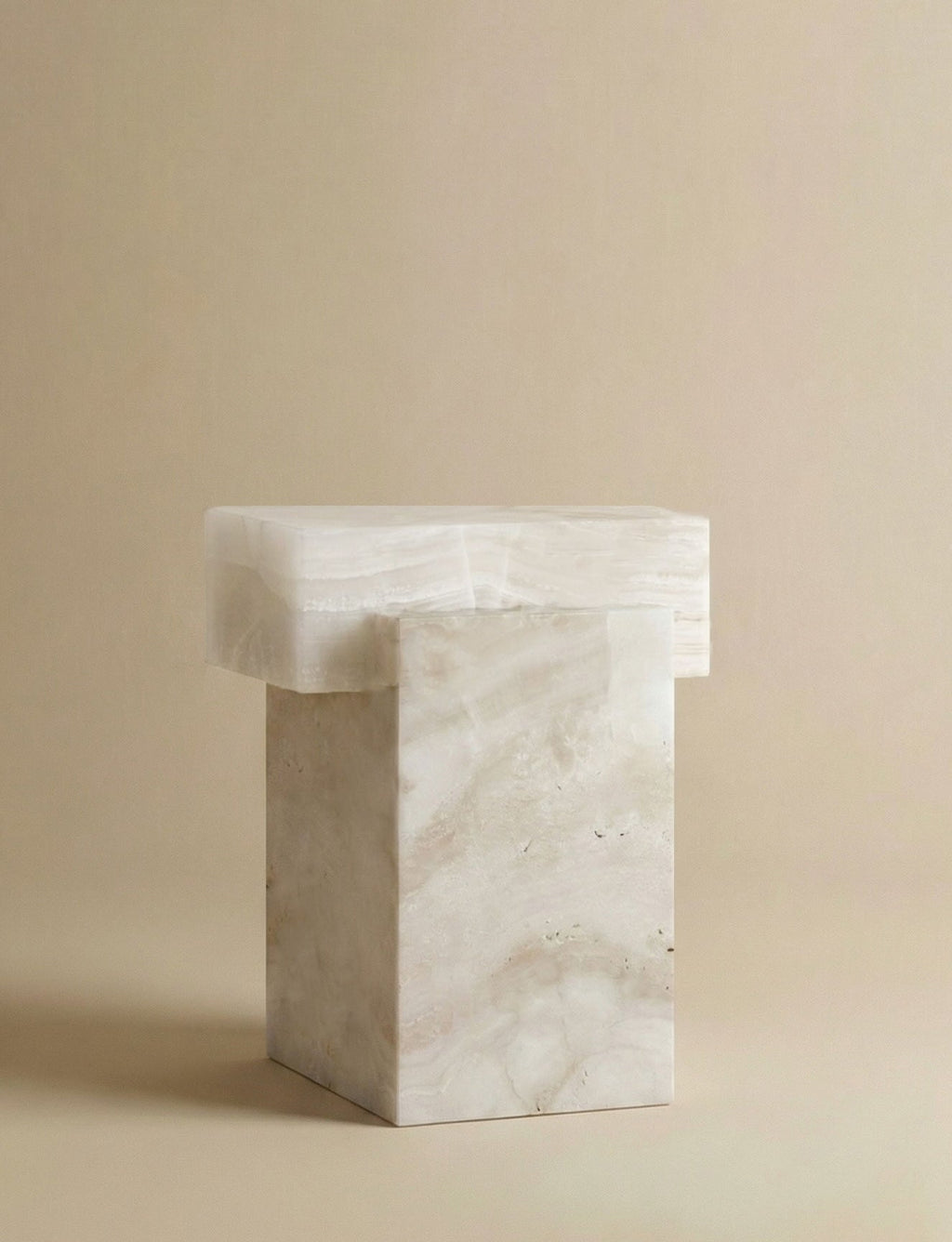 Back view of white onyx travertine table showing dual stone composition and sculptural design details