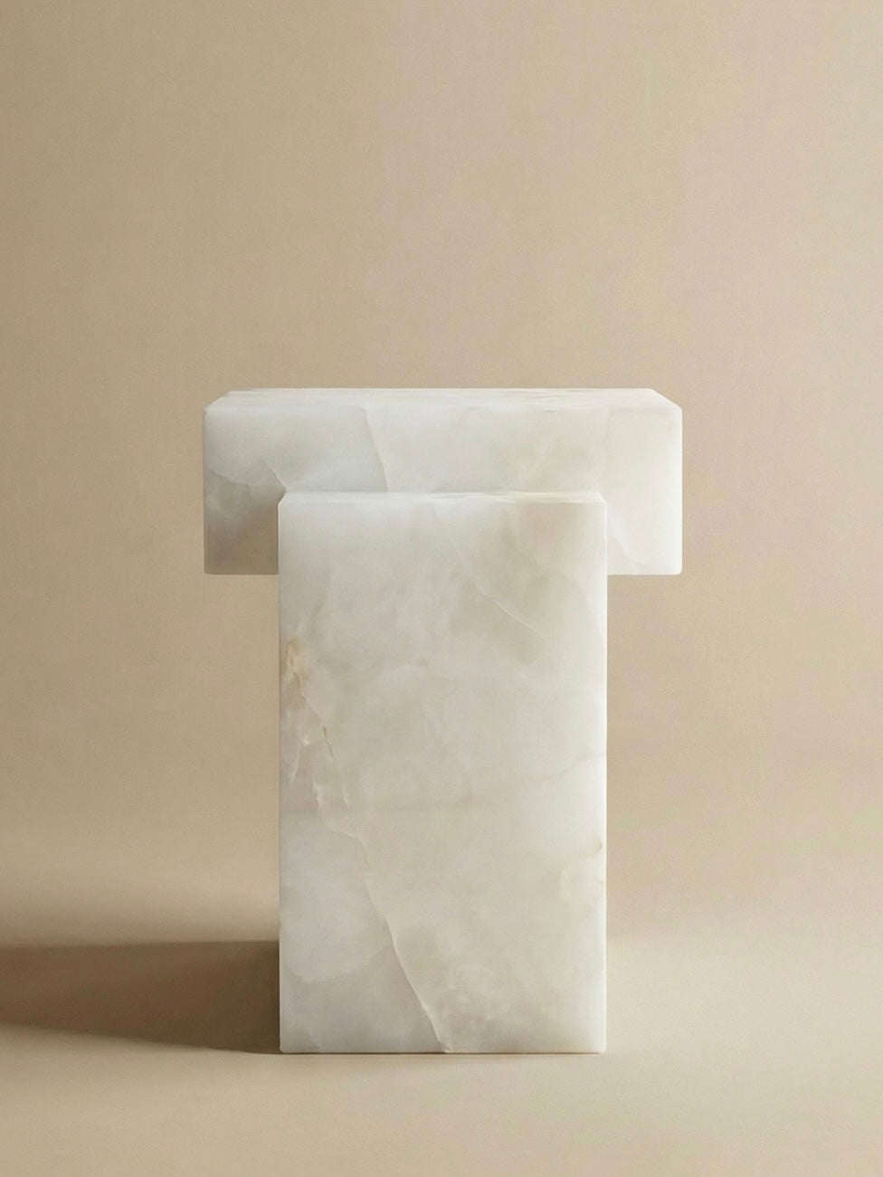 Gaia white onyx dining table profile view highlighting sleek marble silhouette and craftsmanship