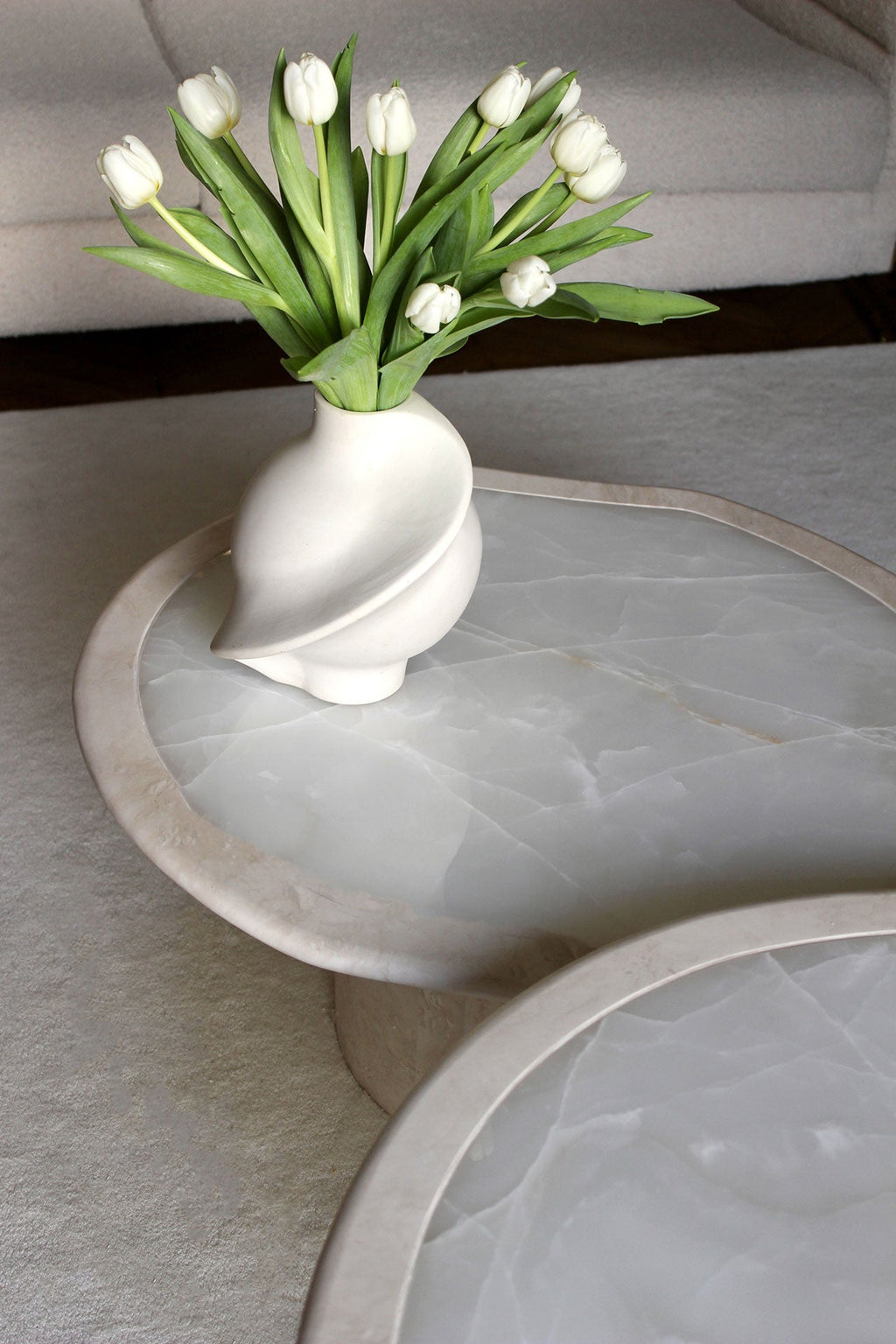 Joan white onyx travertine coffee table styled in modern interior - MARBERA luxury furniture