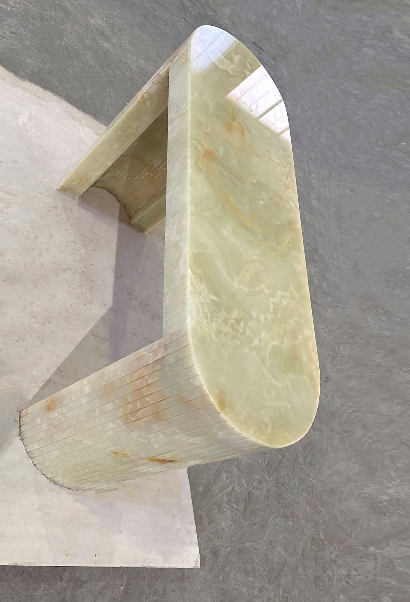 Luna Green Onyx console lifestyle setting showcasing translucent green onyx natural stone beauty