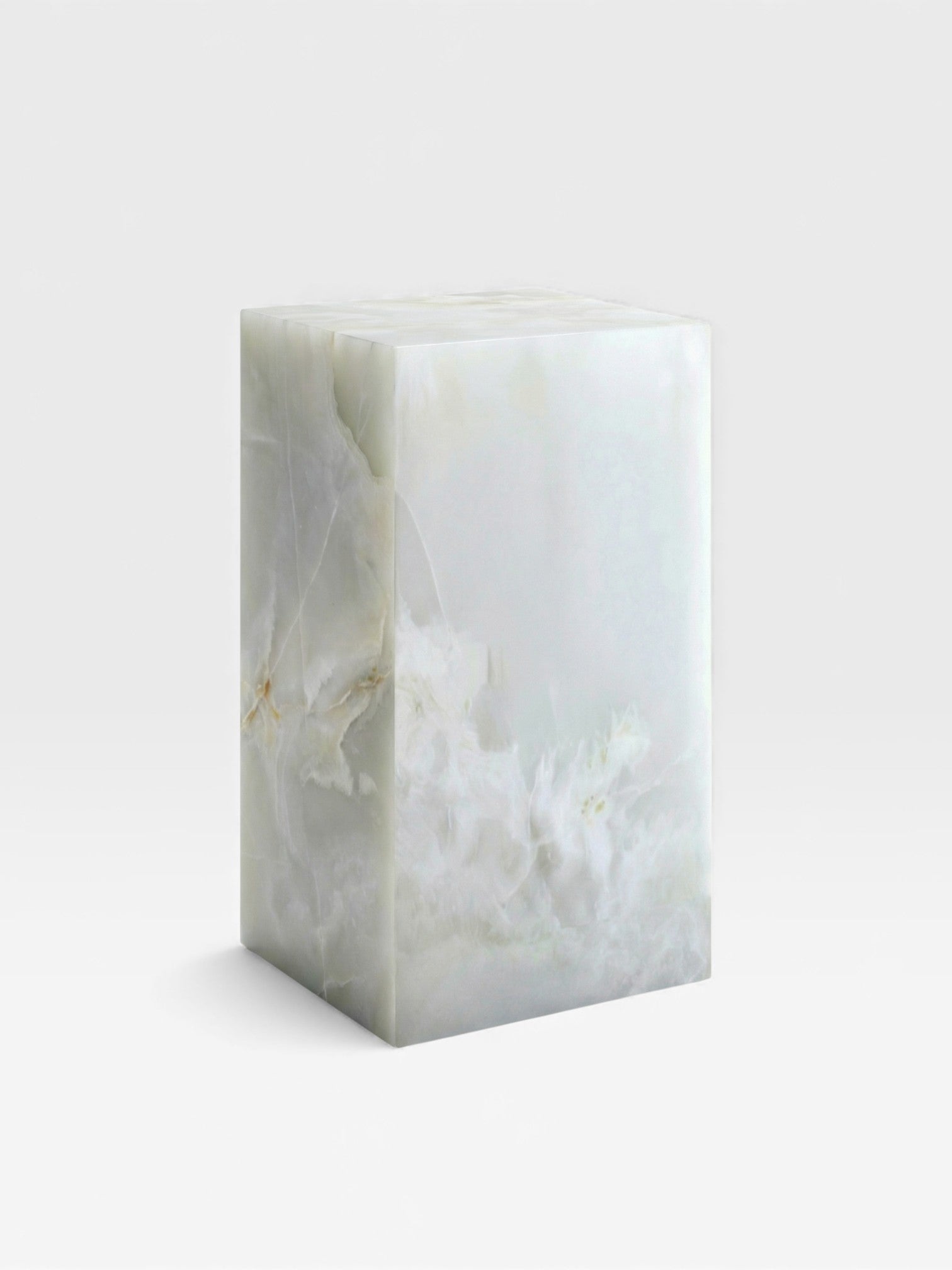 White onyx plinth by MARBERA - premium Italian natural stone display furniture left angle view